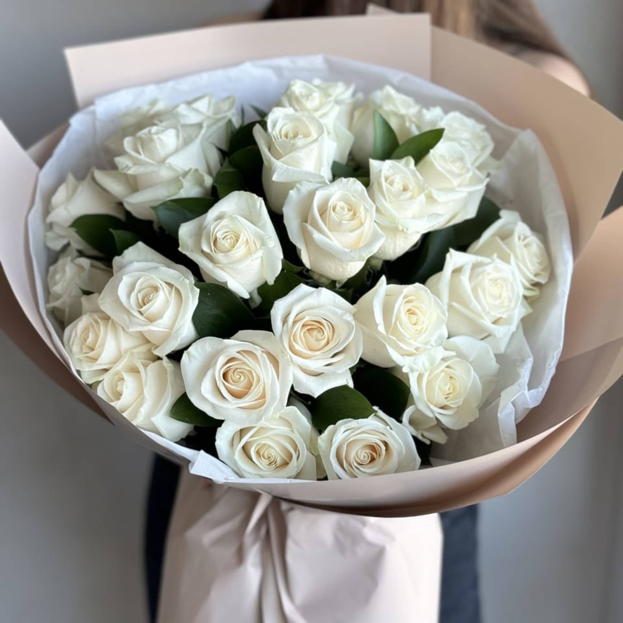 An exquisite hand-held bouquet, including 25 White Vendetta Roses, symbolizing purity and