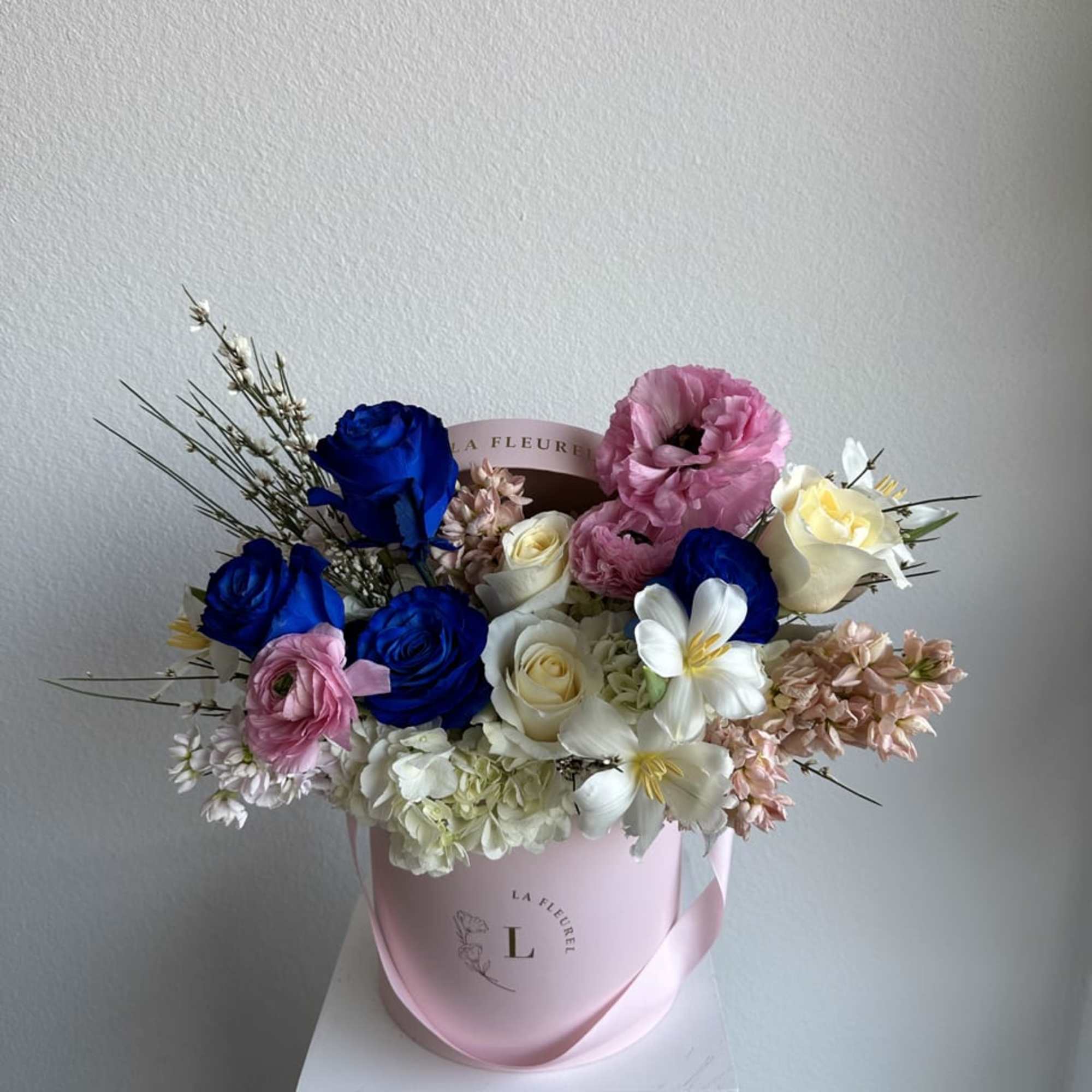 This romantic arrangement includes roses, tulips, stock and greens.

Perfect for any occasion.
You