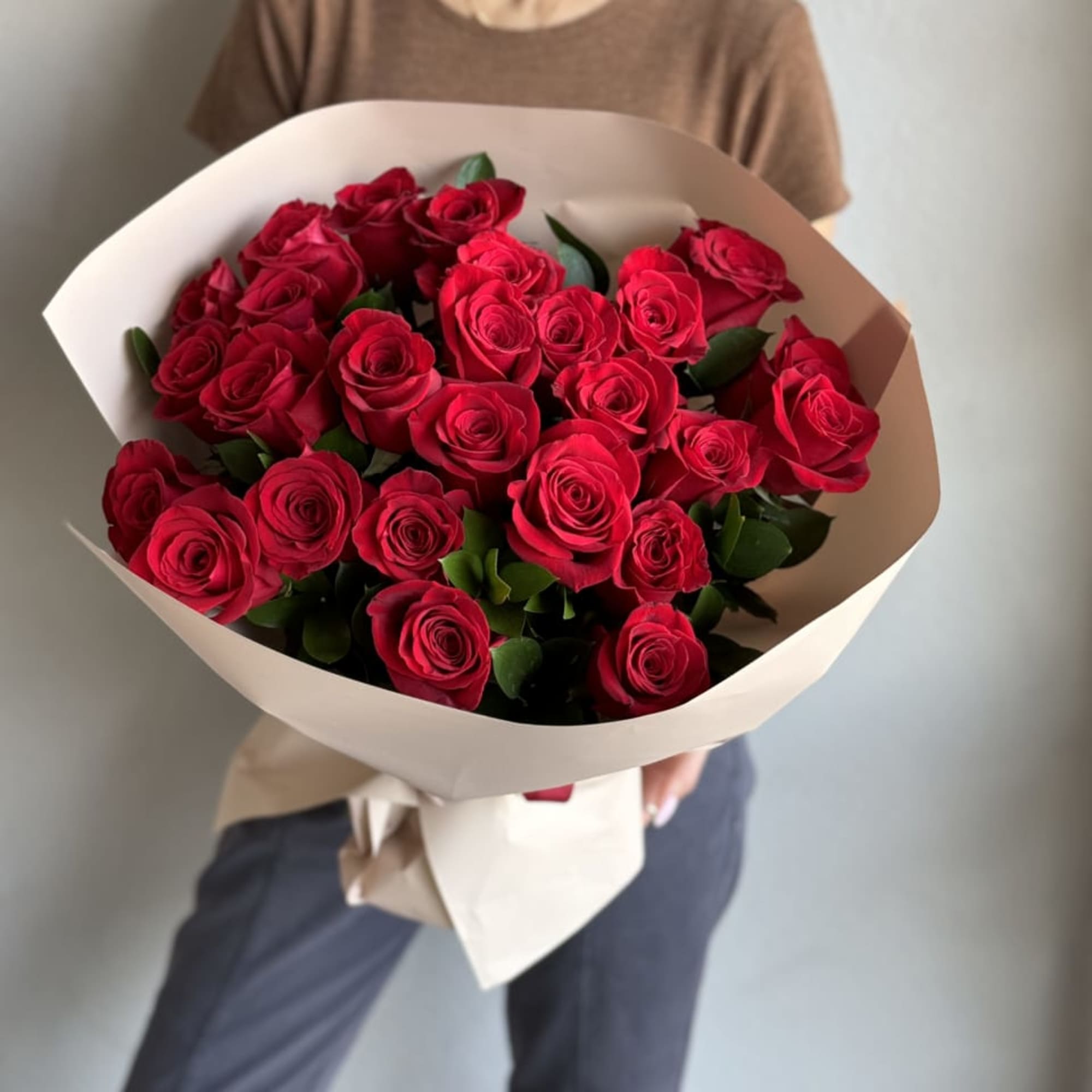 Indulge in the timeless allure of our Red Roses Bouquet, boasting 25
