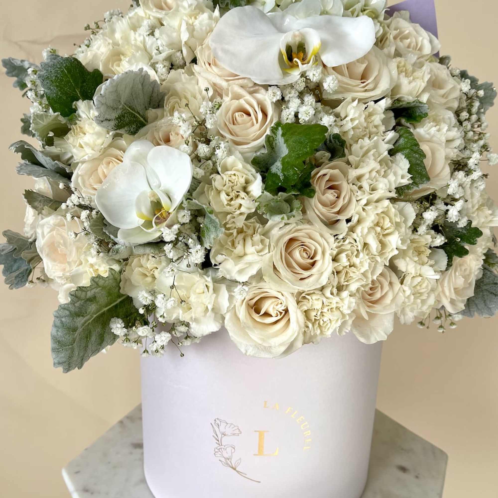 This beautiful arrangement is filled with white roses to deliver your special