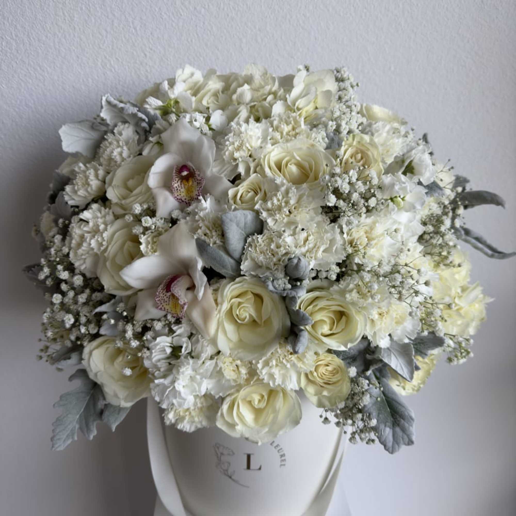 This beautiful arrangement is filled with white roses to deliver your special