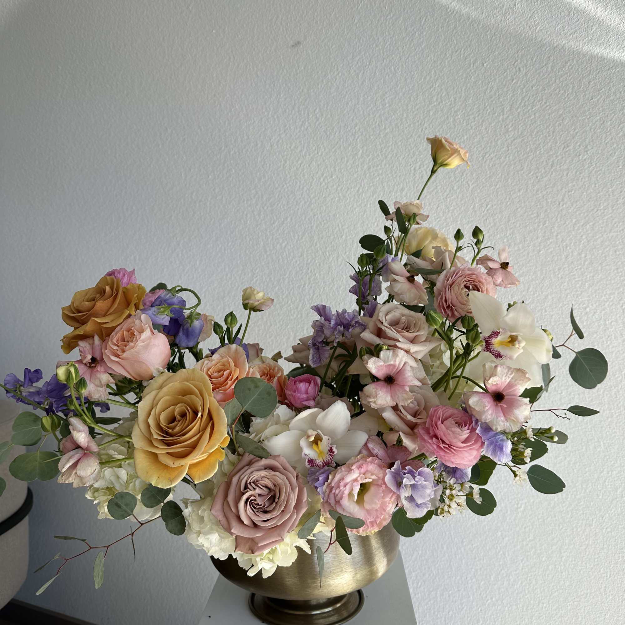 This breathtaking arrangement includes roses, hydrangeas, spray roses, lisianthus, wax and greens.

Perfect