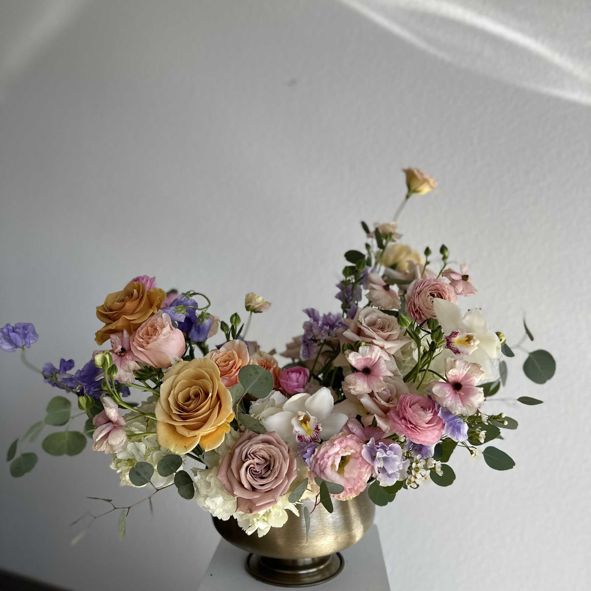 This breathtaking arrangement includes roses, hydrangeas, spray roses, lisianthus, wax and greens.

Perfect