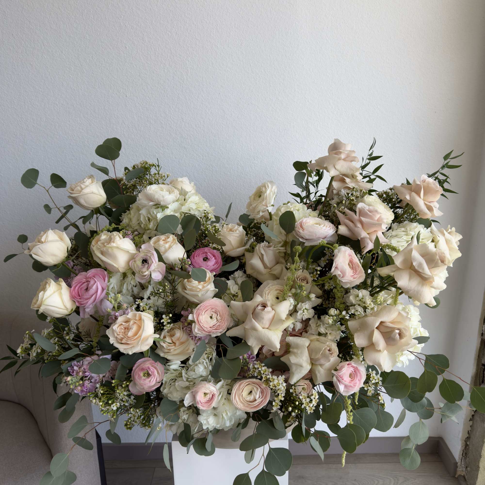This beautiful arrangement filled with the roses, hydrangeas, peonies and orchids to