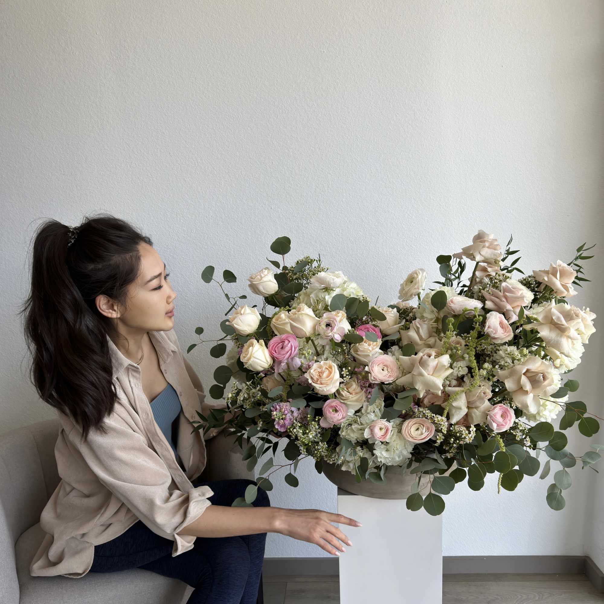 This beautiful arrangement filled with the roses, hydrangeas, peonies and orchids to