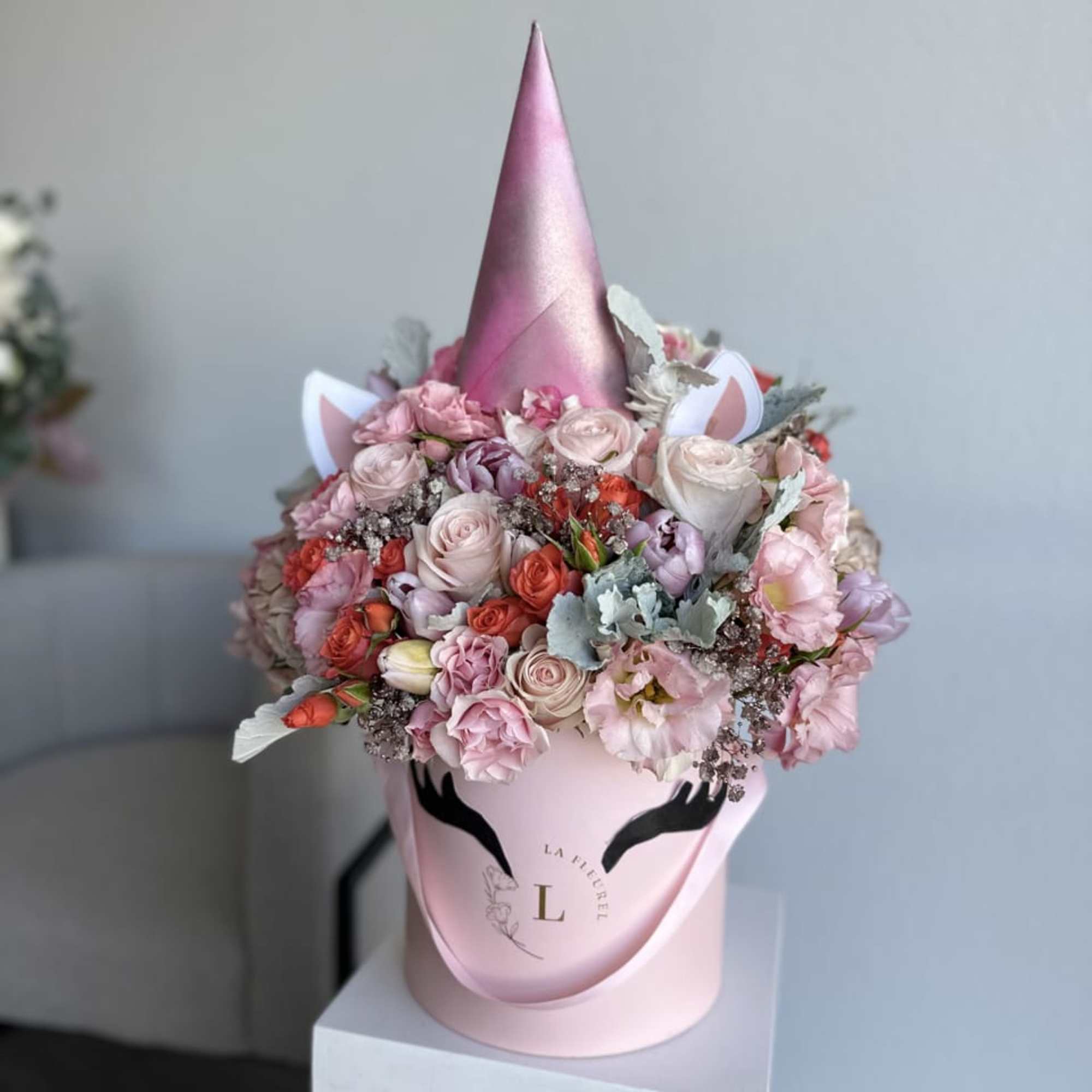 This beautiful box contains a combination of fresh tulips, hydrangeas, greens and