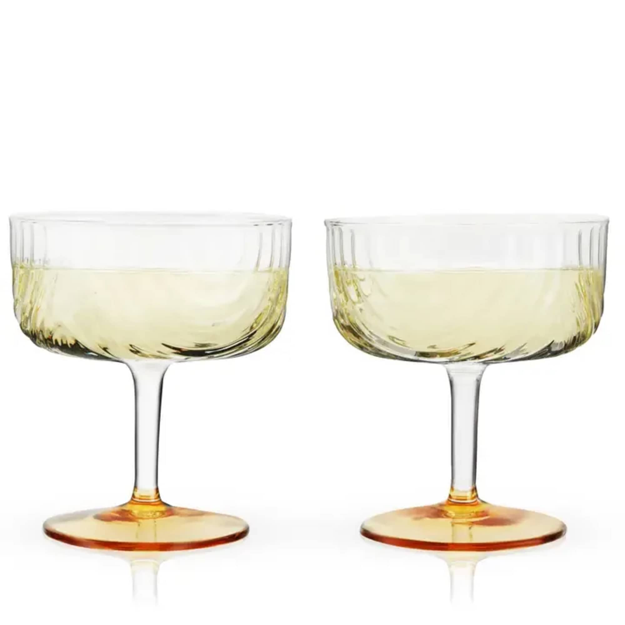 Draping glass and polished gold details give this stemmed glassware set Jazz