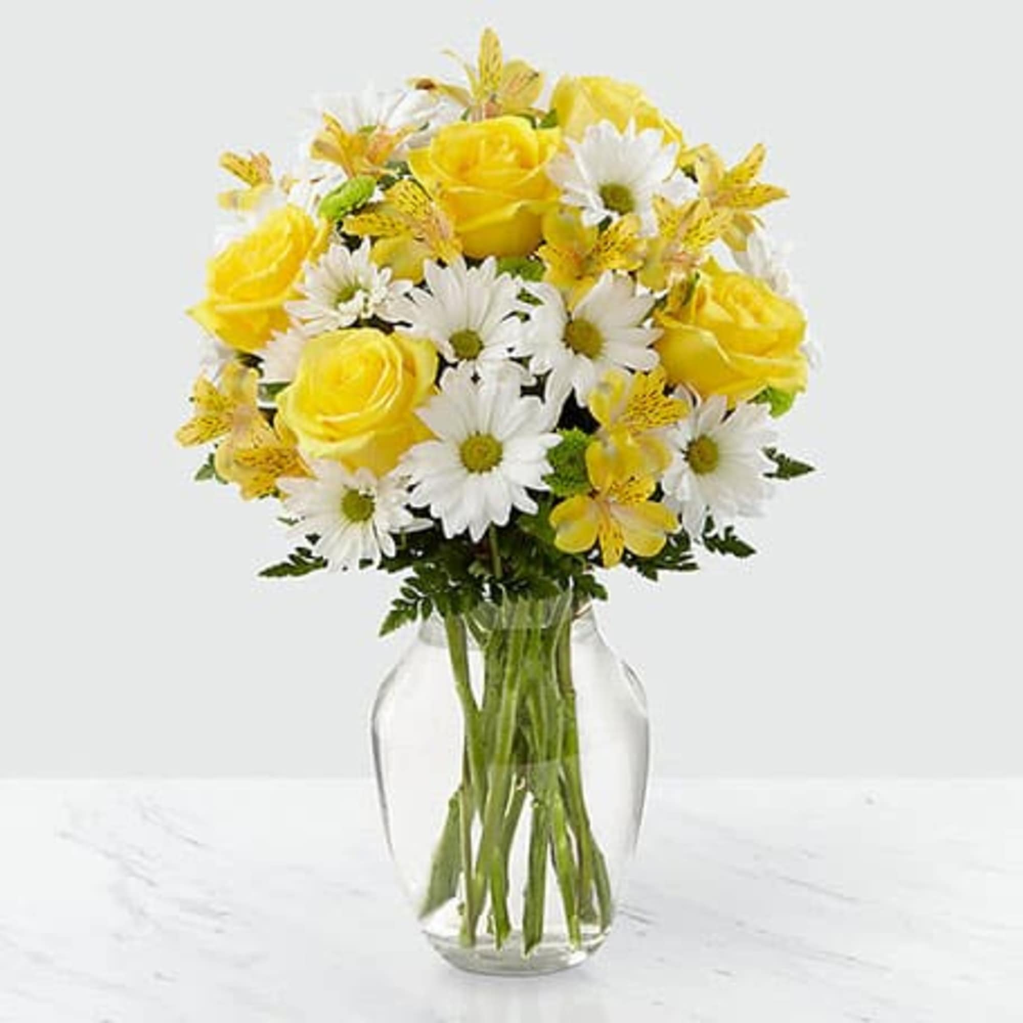 A beautiful sunny arrangement of yellow roses and white daisies A beautiful sunny arrangement of yellow roses and white daisies
