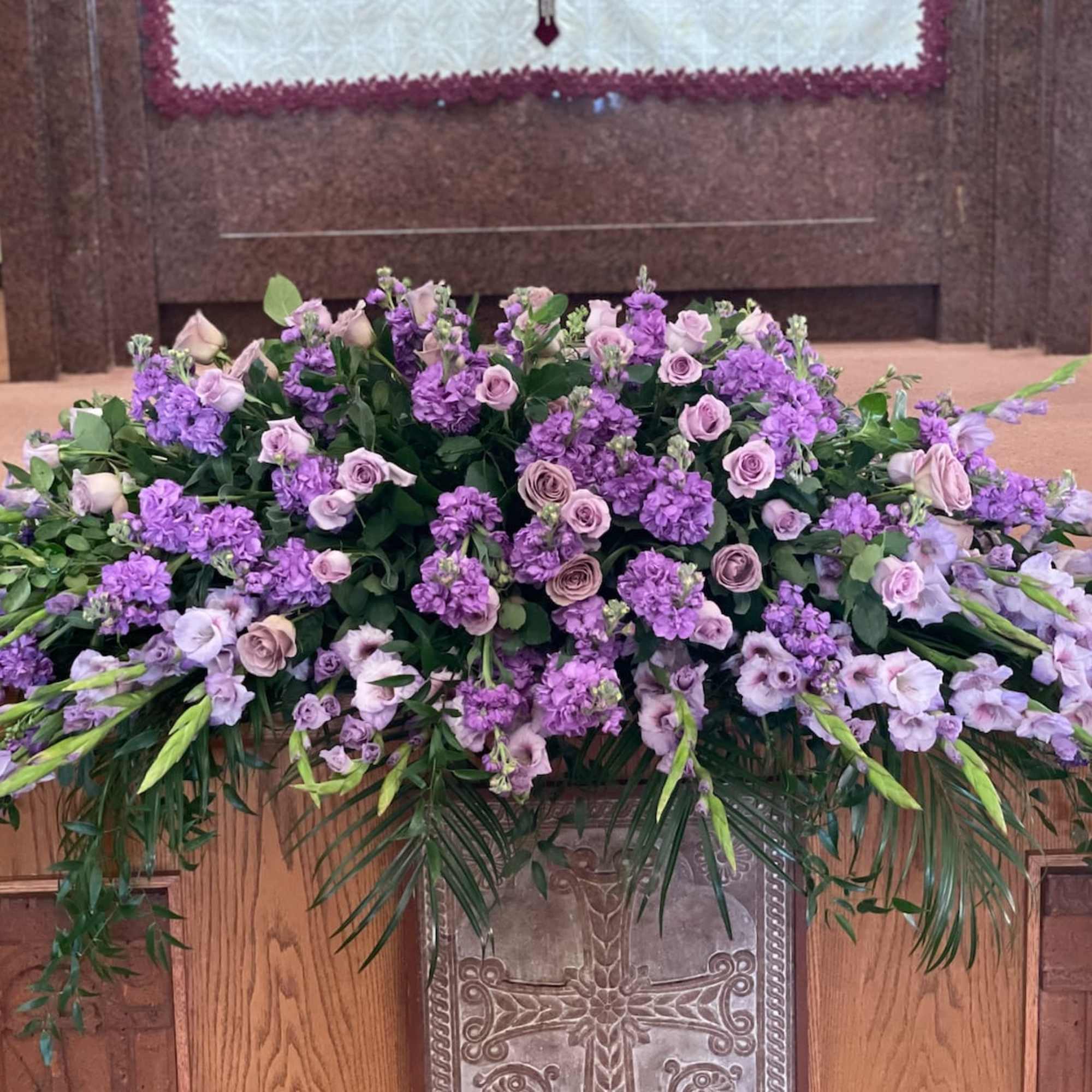 This casket is made with seasonal lavender flowers and greens.

Standard size is
