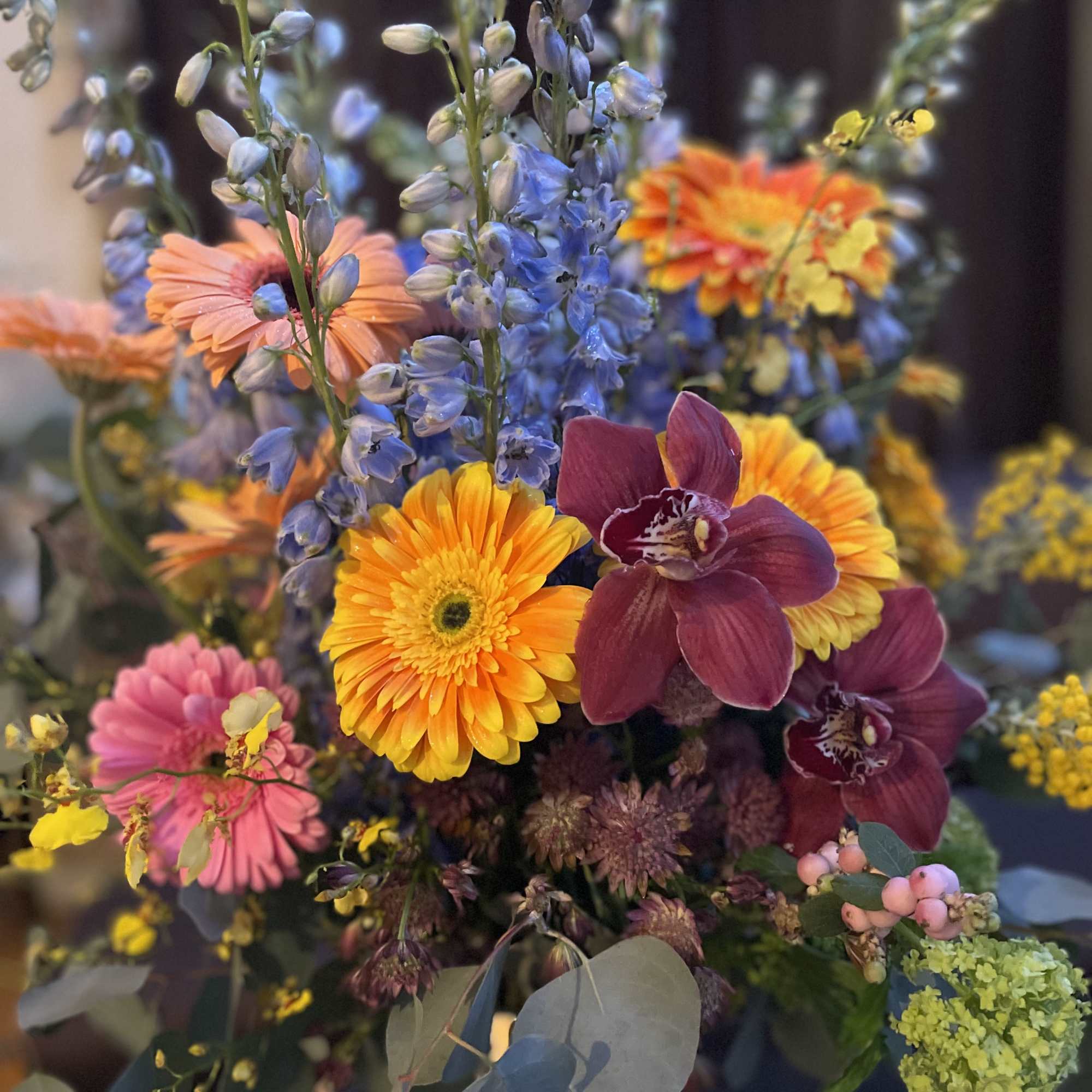 This beautiful flower arrangement features vibrant gerbera daisies, symbolizing new beginnings, family