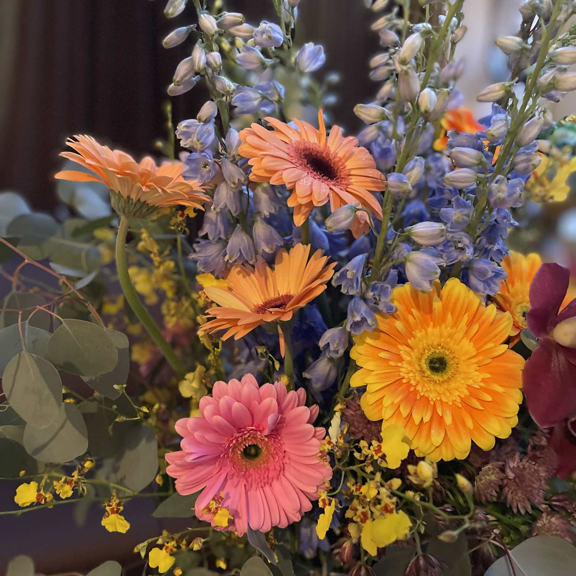 This beautiful flower arrangement features vibrant gerbera daisies, symbolizing new beginnings, family