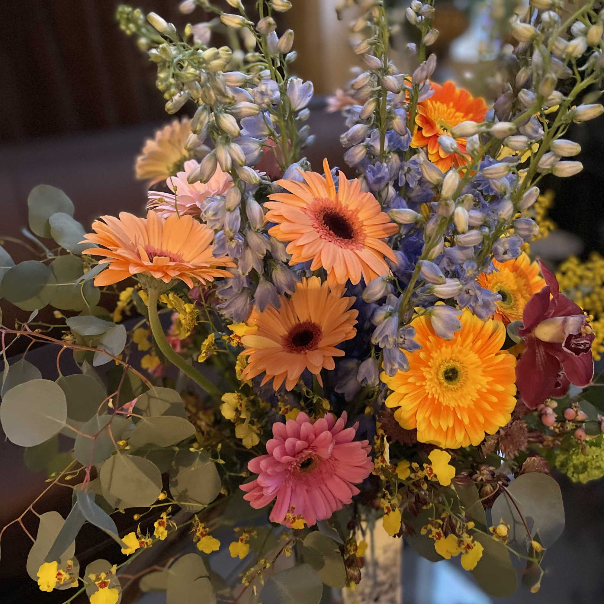 This beautiful flower arrangement features vibrant gerbera daisies, symbolizing new beginnings, family