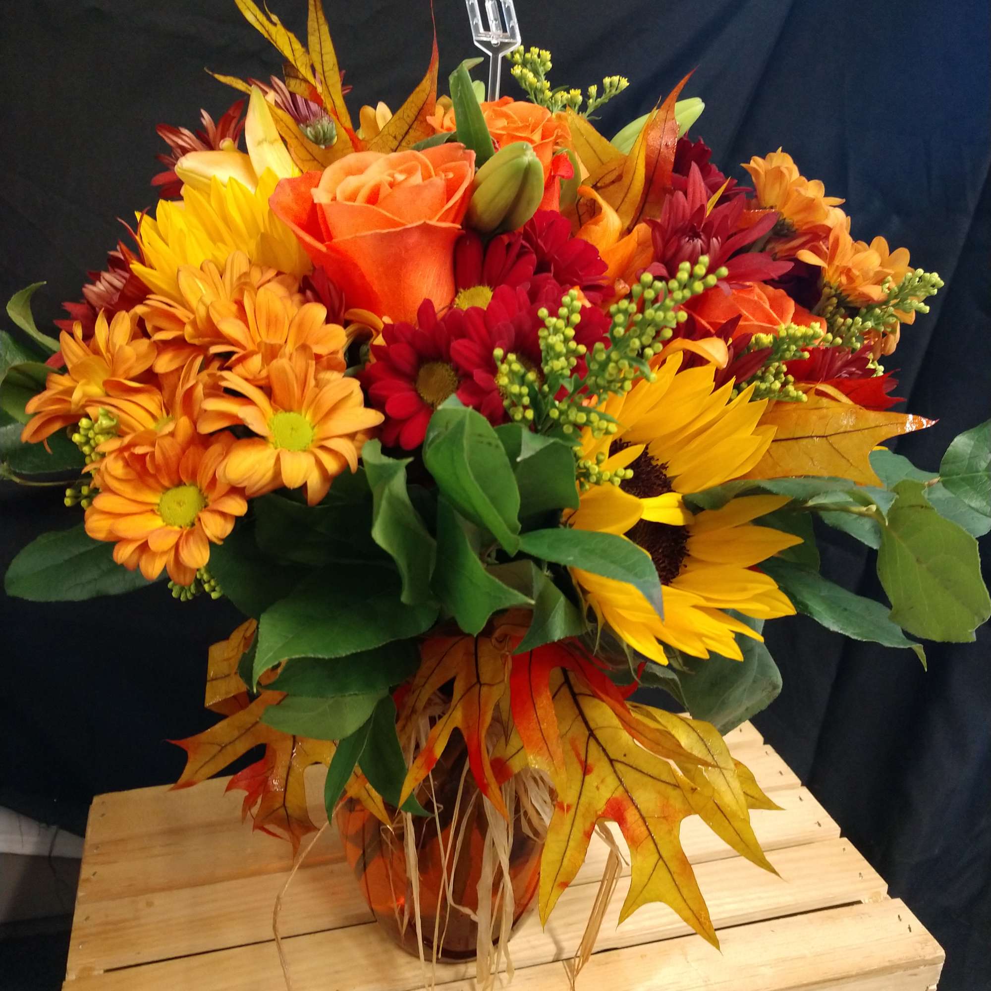 Orange roses sunflowers orange lilies rusk pomp Solidago,  Sala fall leaves Orange roses sunflowers orange lilies rusk pomp Solidago,  Sala fall leaves