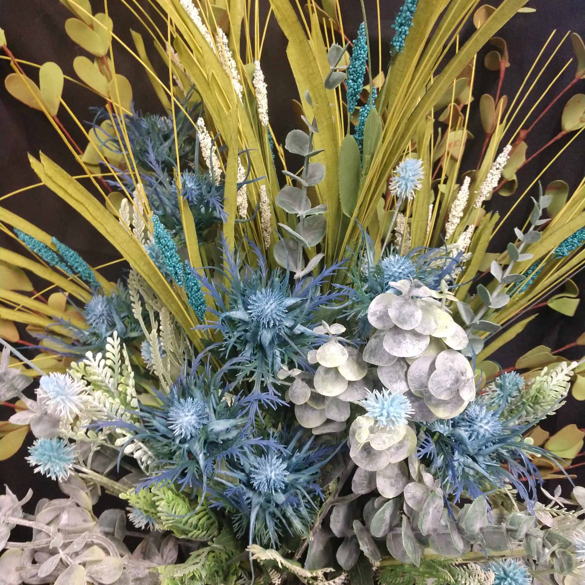 All silk flowers in a white galvanized bucket soak flowers are meadow All silk flowers in a white galvanized bucket soak flowers are meadow