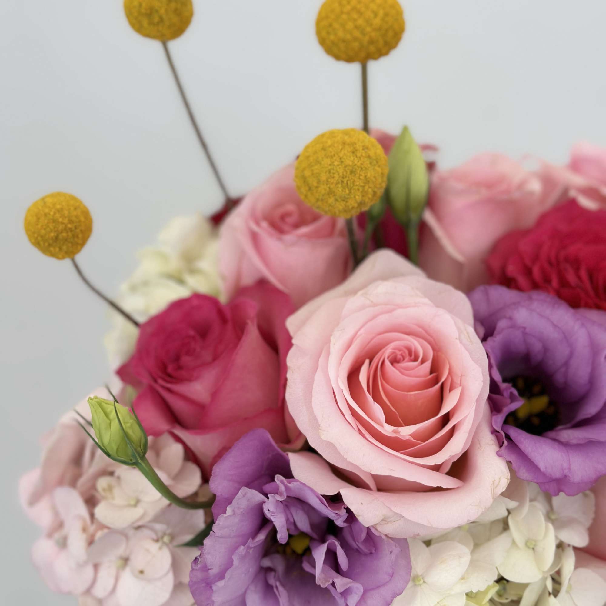 Enhance any occasion with this stunning arrangement, featuring a beautiful blend roses