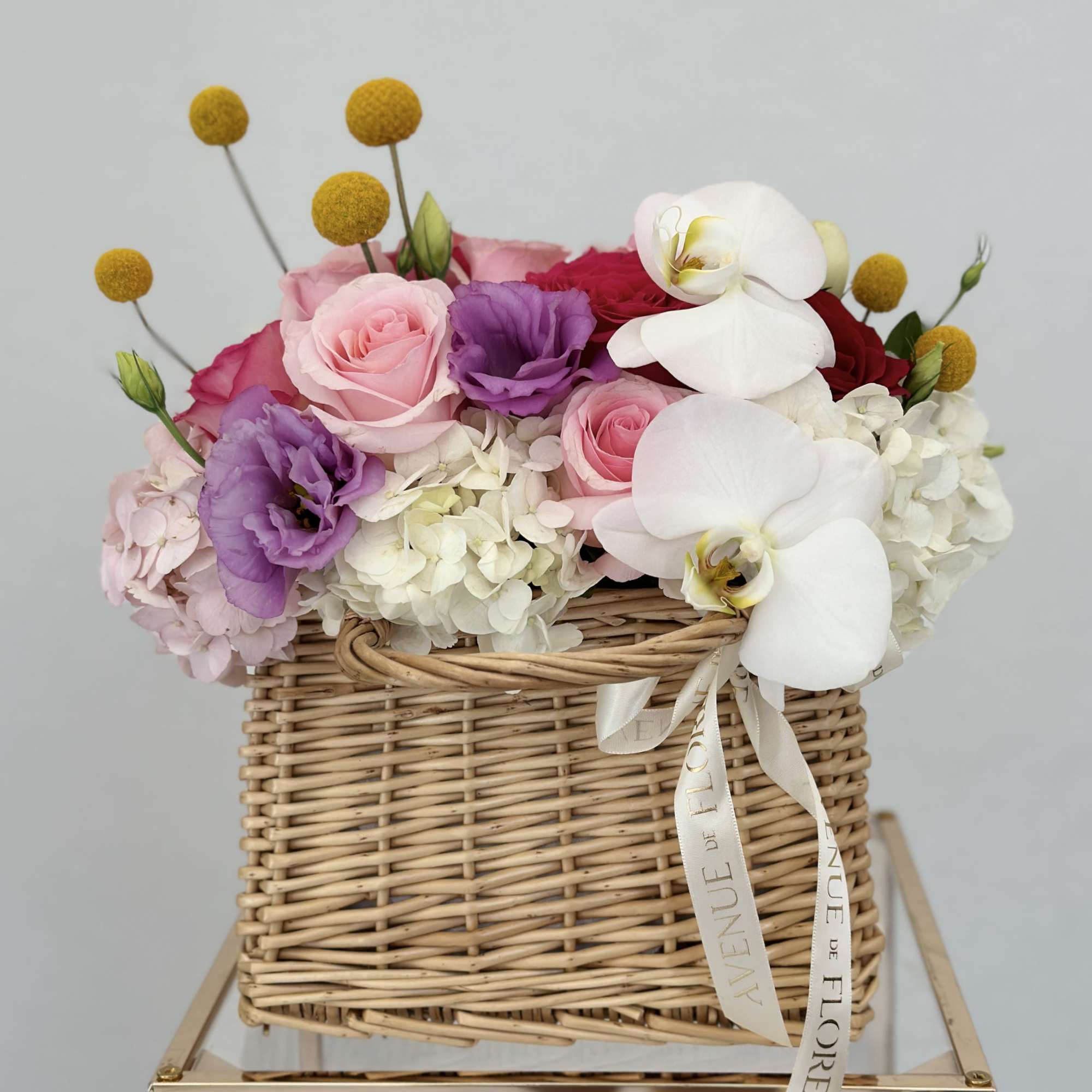 Enhance any occasion with this stunning arrangement, featuring a beautiful blend roses