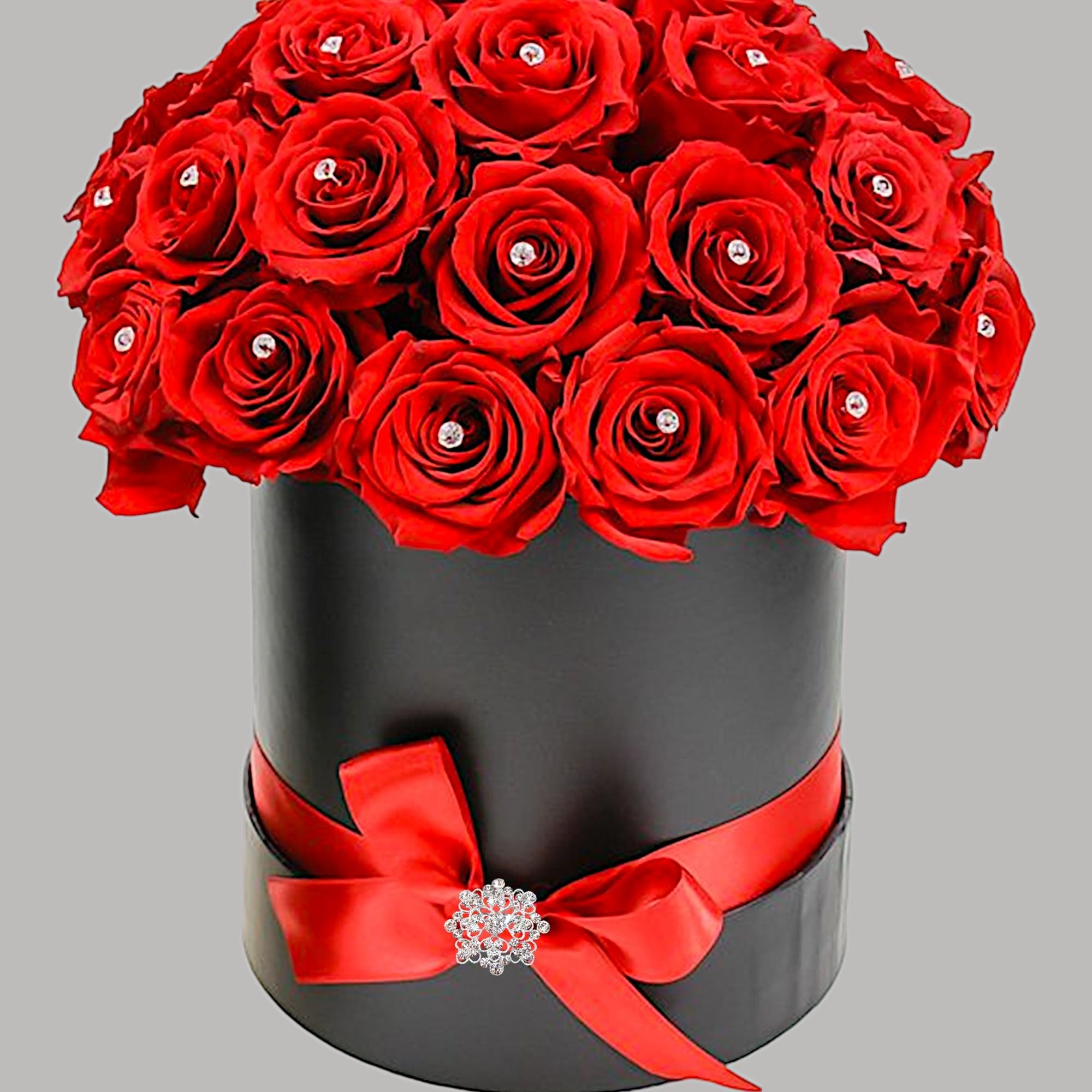 A modern flower arrangement in a cylinder box filled with roses. Each