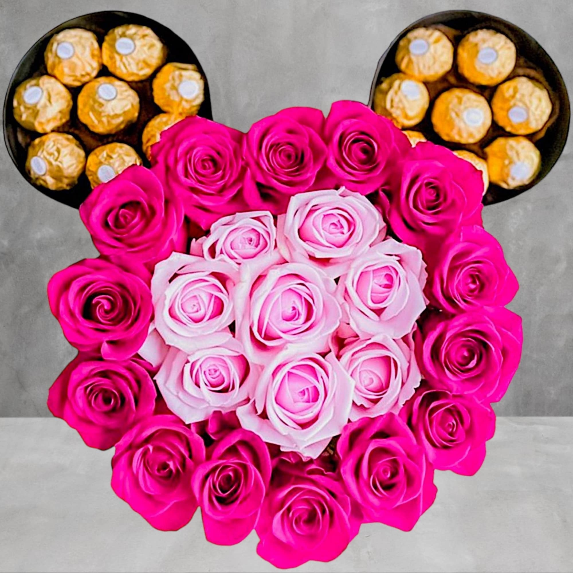 A modern flower arrangement in a Mickey box filled with roses &amp;