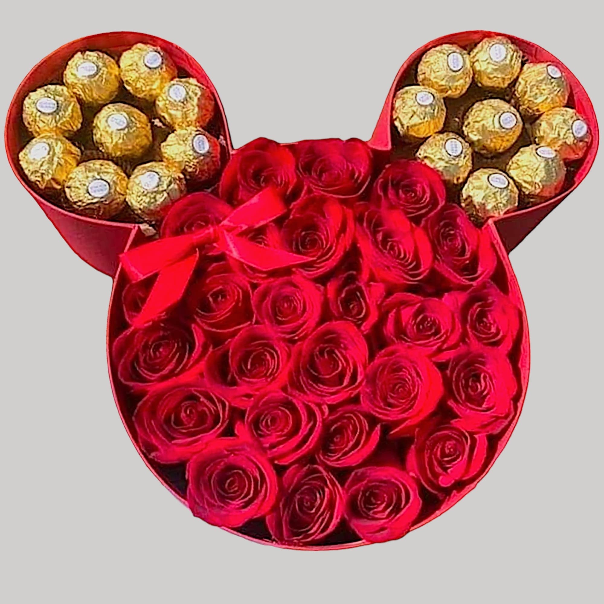 A modern flower arrangement in a Minnie box filled with roses &amp;