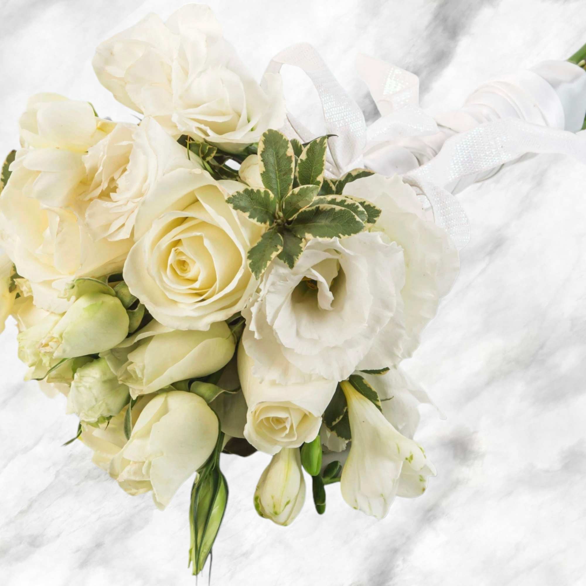 A classic white rose bouquet hand tied with ribbon. The perfect accessory