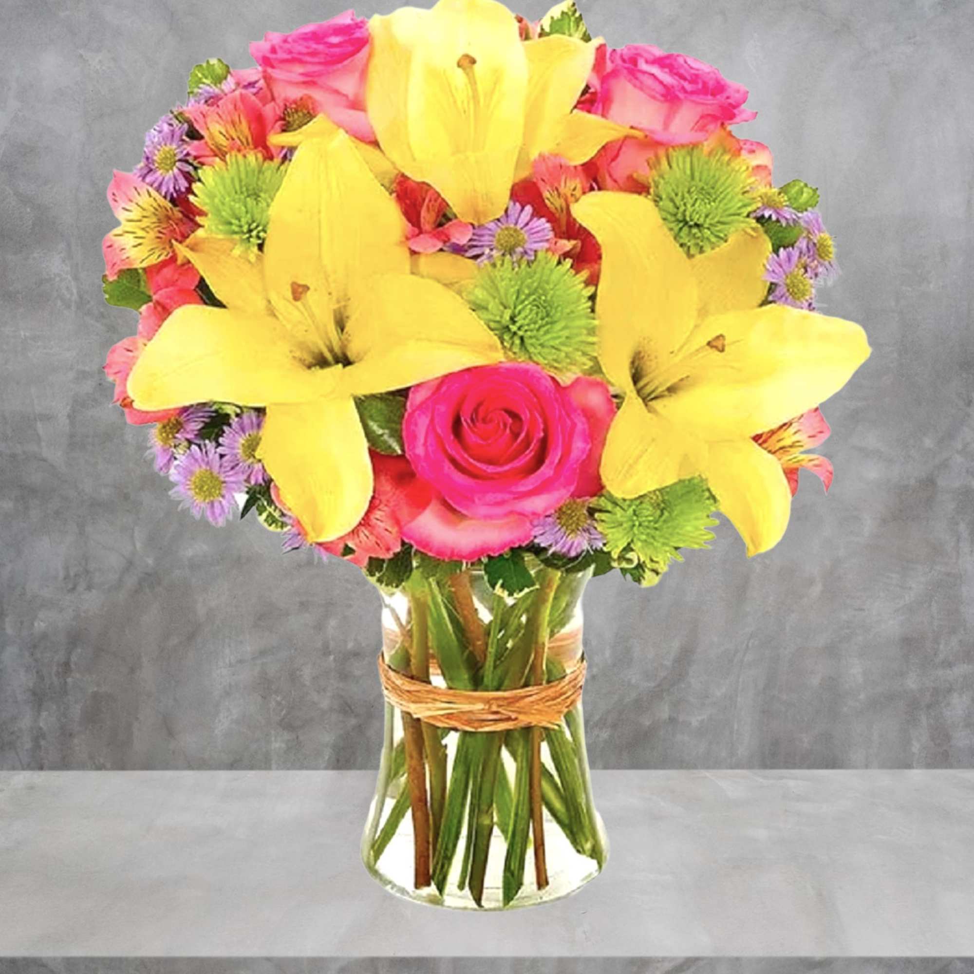 This bright and beautiful flower arrangement will brighten someone&#039;s day with a