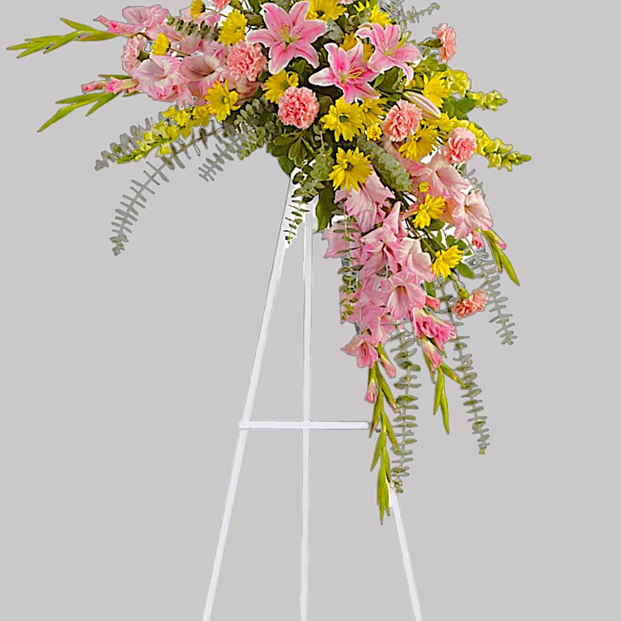 Soft, soothing pink lilies &amp; yellow daisies are crafted into a crescent