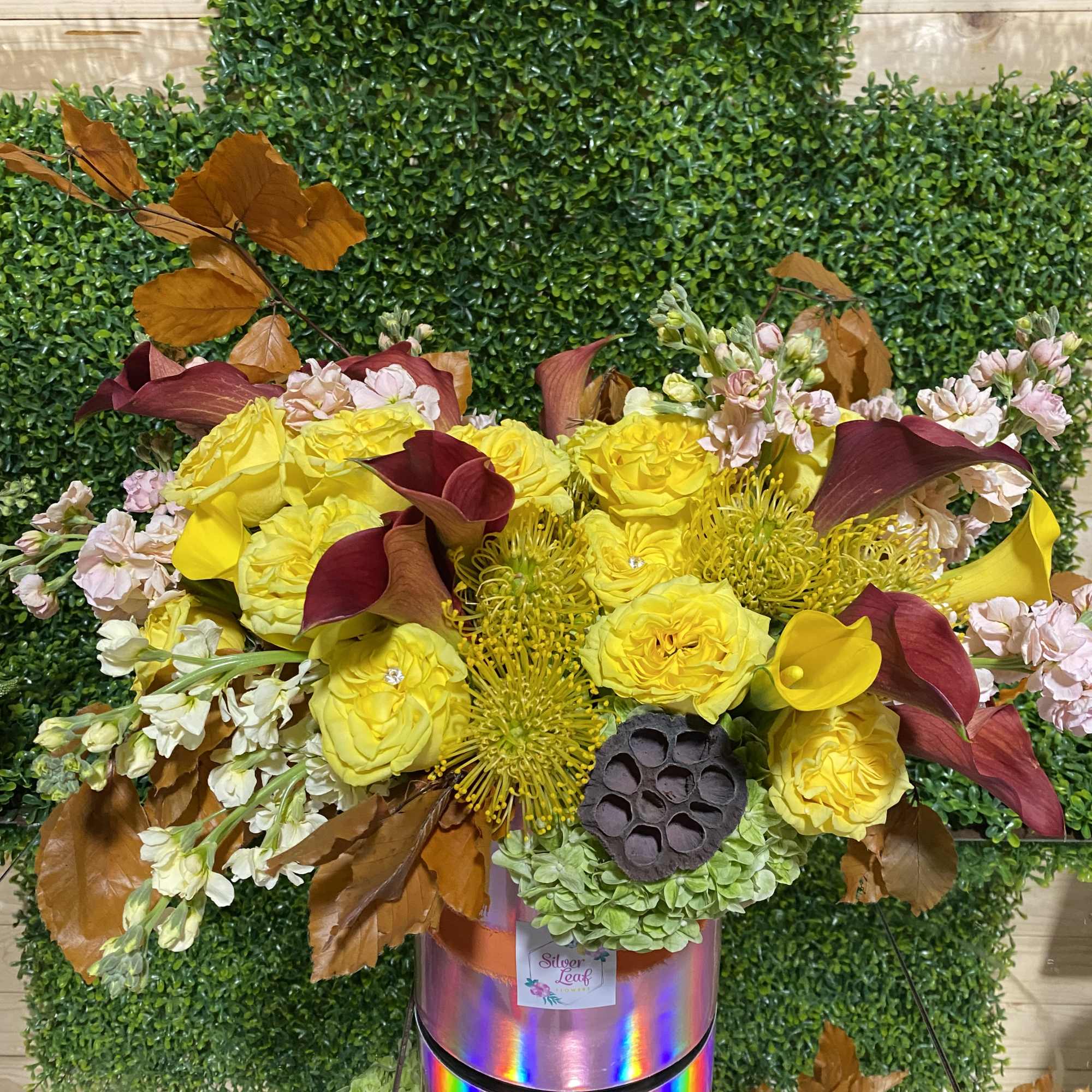 Fall colors in one vase , orang, yellow, apricot, salmon and pompoms