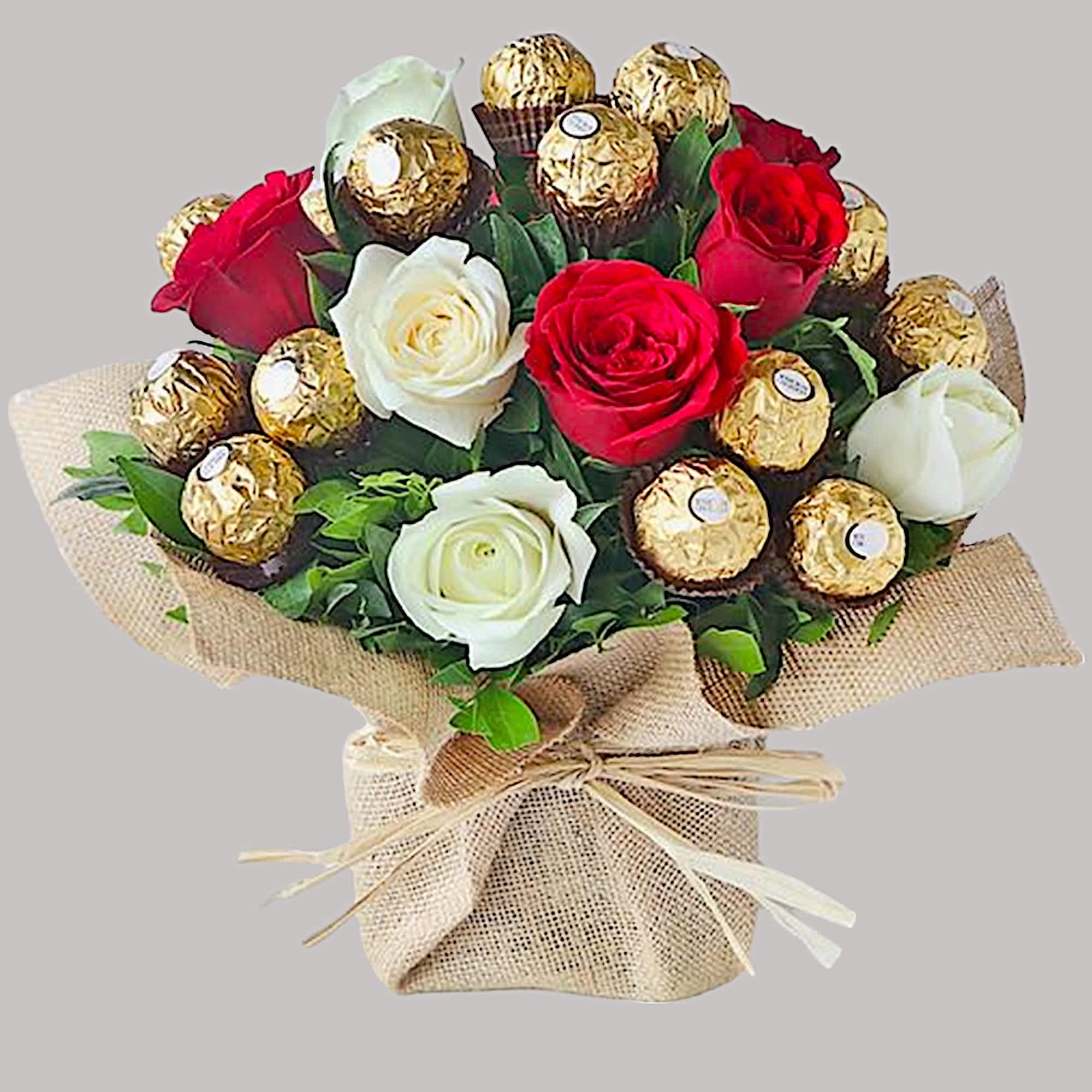 A modern flower arrangement filled with roses and chocolates.
Picked fresh from farms