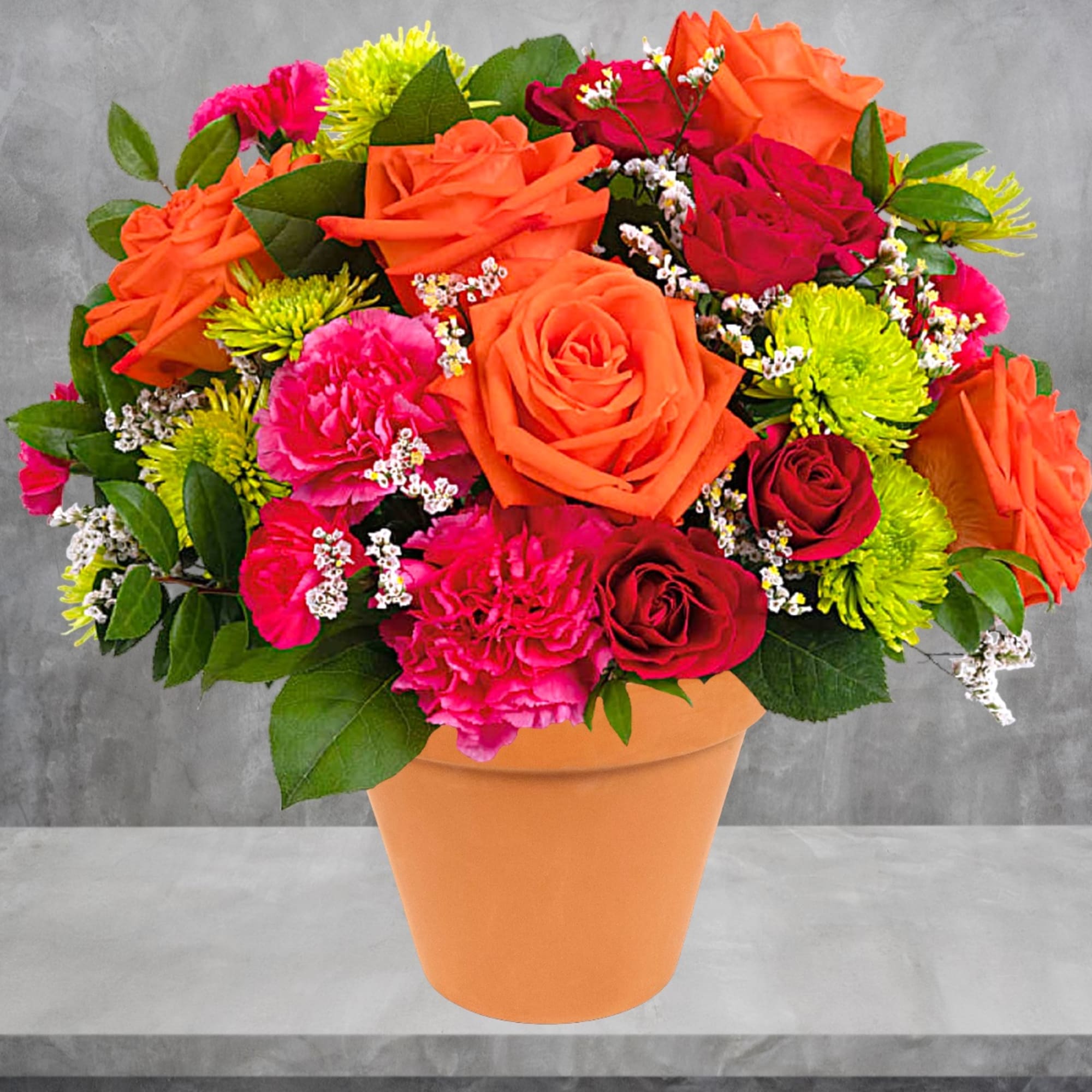 A dreamy dose of happiness, this beautiful orange and pink arrangement looks