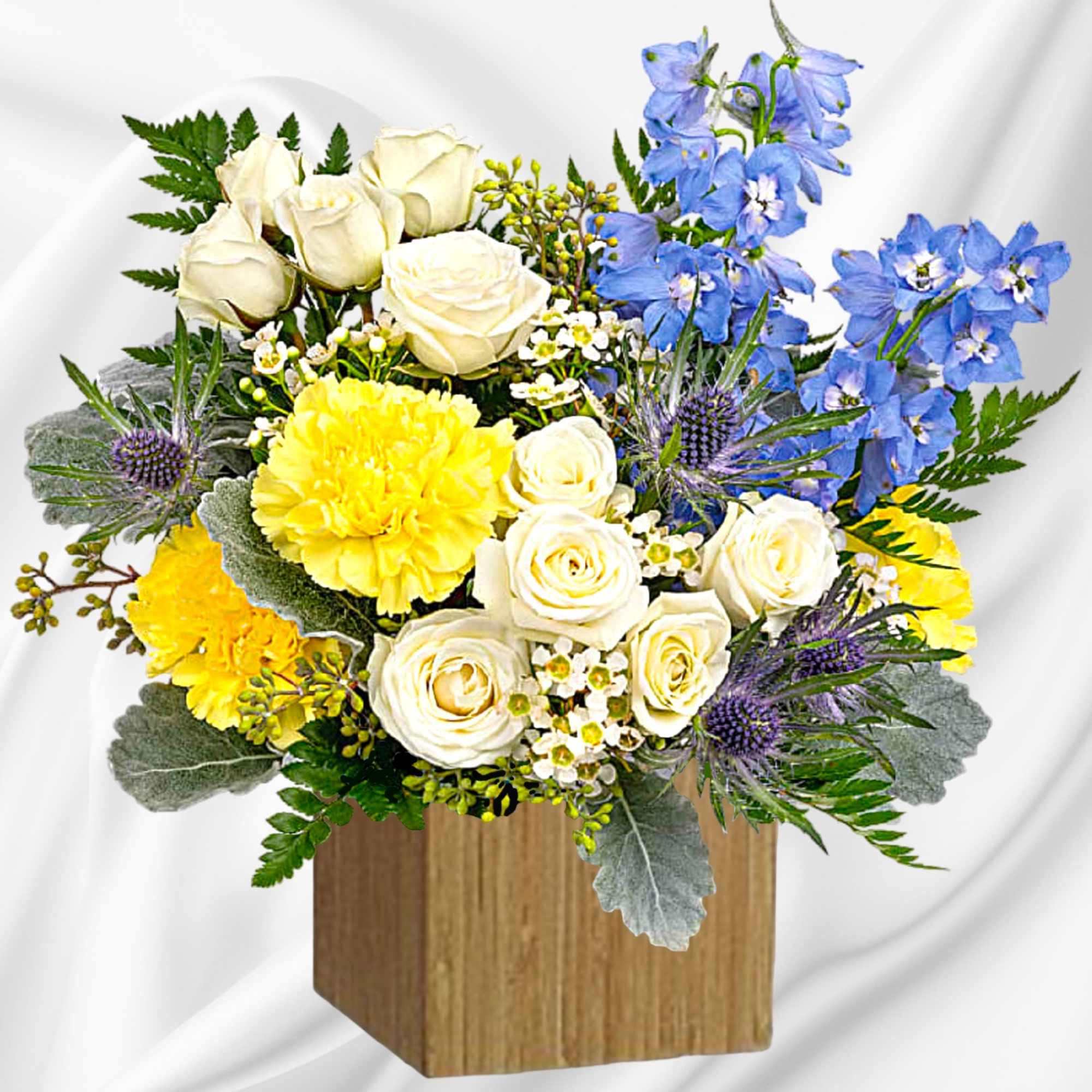 Like wispy clouds in a bright blue sky, this beautiful arrangement of
