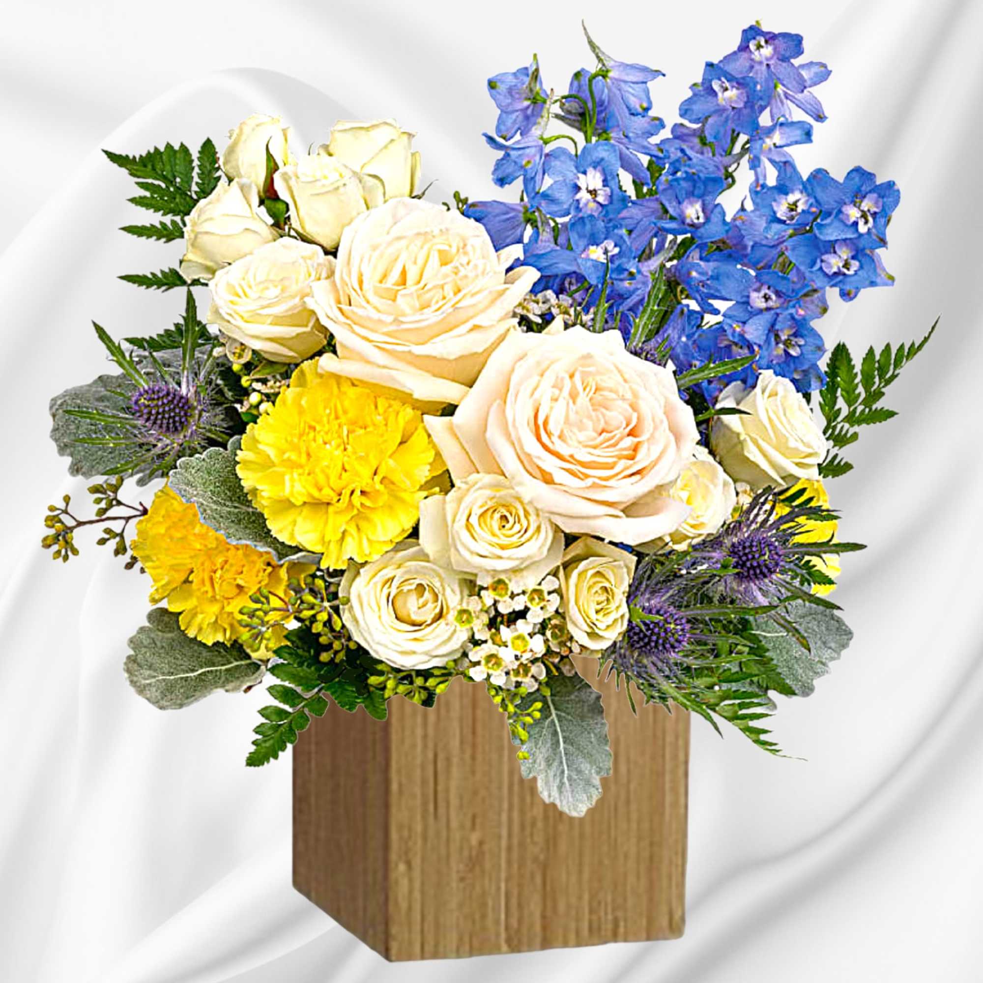 Like wispy clouds in a bright blue sky, this beautiful arrangement of