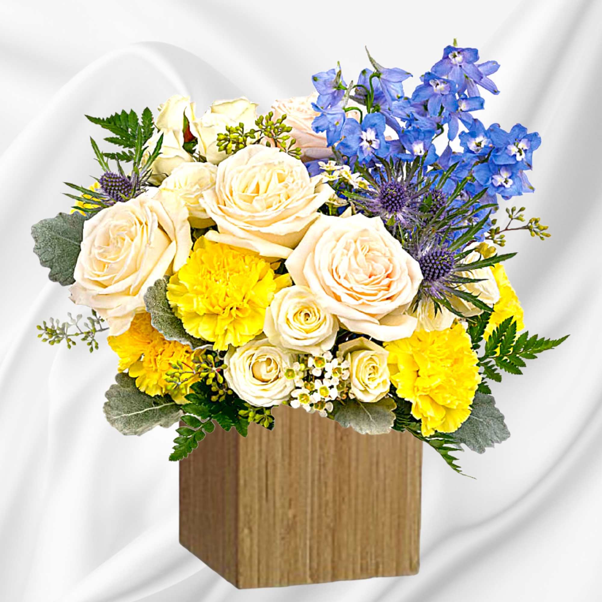 Like wispy clouds in a bright blue sky, this beautiful arrangement of