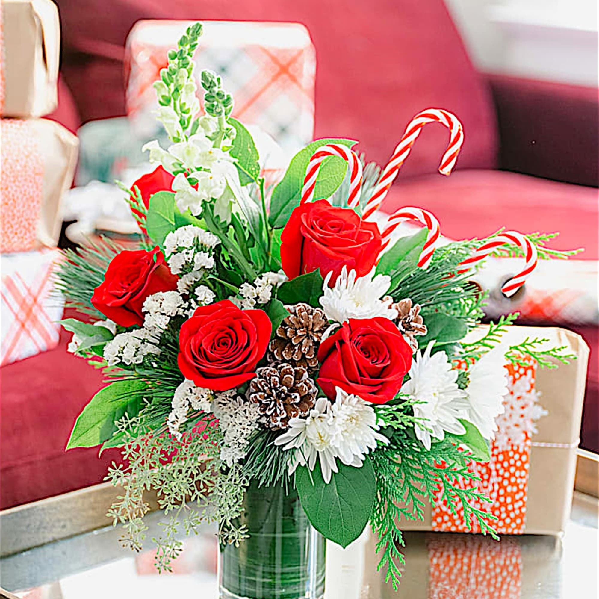 An instant Christmas party, this festive arrangement bursts with fresh blooms of
