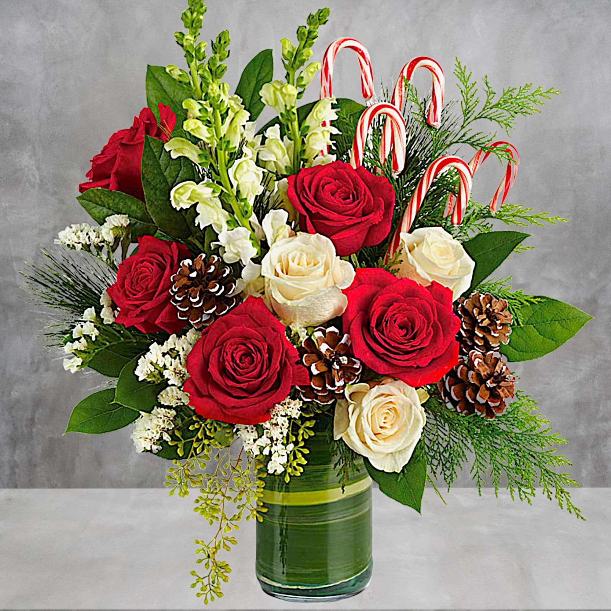 An instant Christmas party, this festive arrangement bursts with fresh blooms of