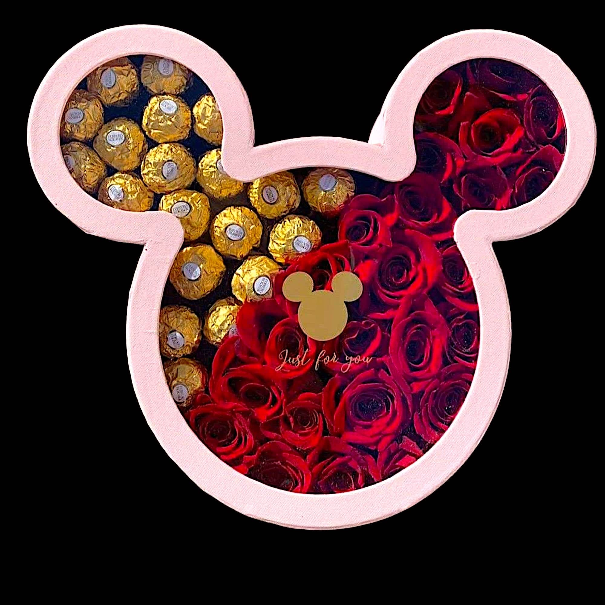 A modern flower arrangement in a mickey box filled with roses &amp;