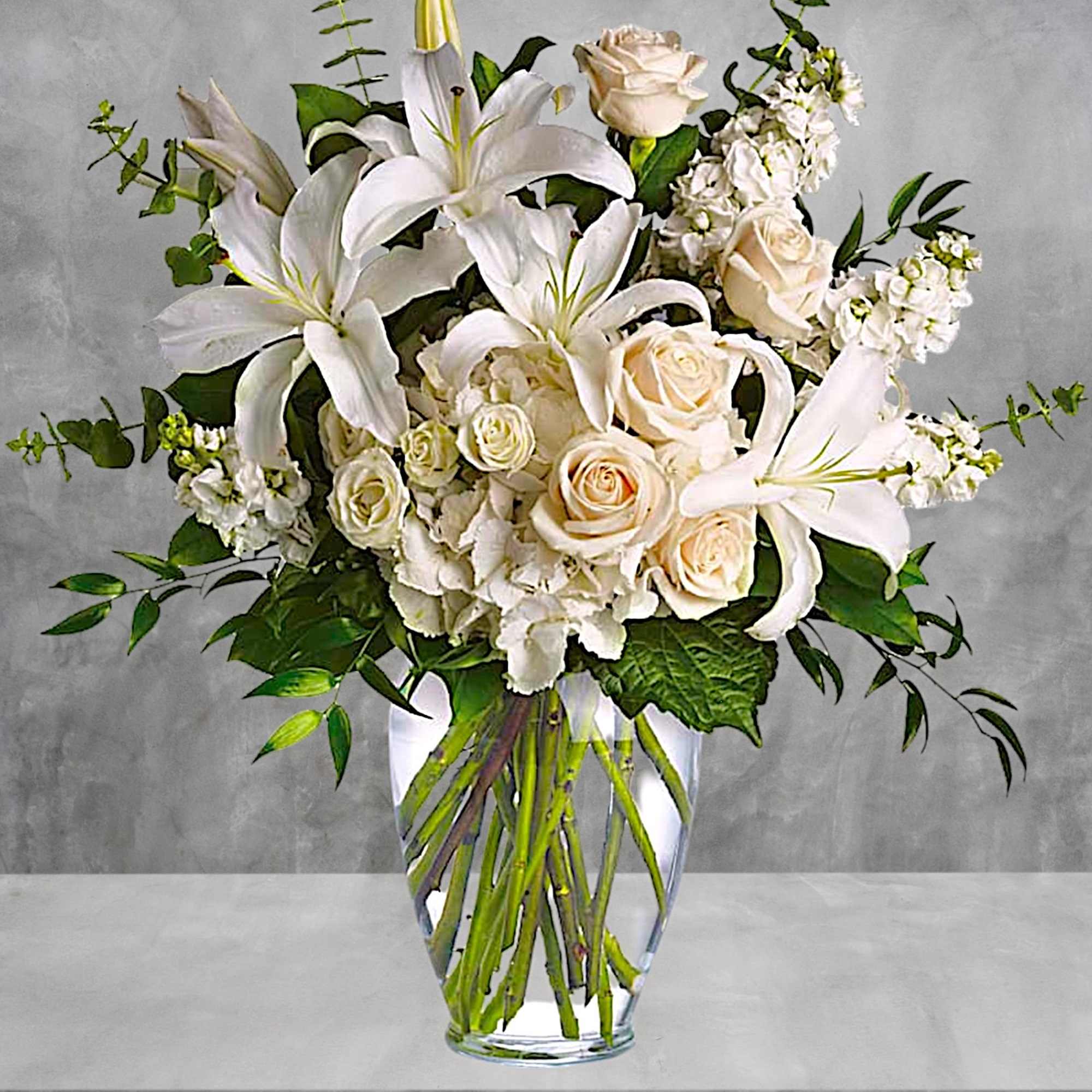 A dreamy bouquet of white sympathy flowers is a comforting reminder of