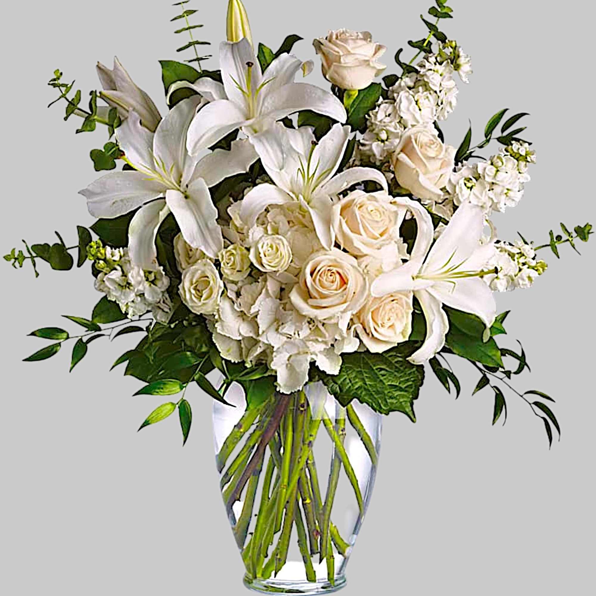 A dreamy bouquet of white sympathy flowers is a comforting reminder of
