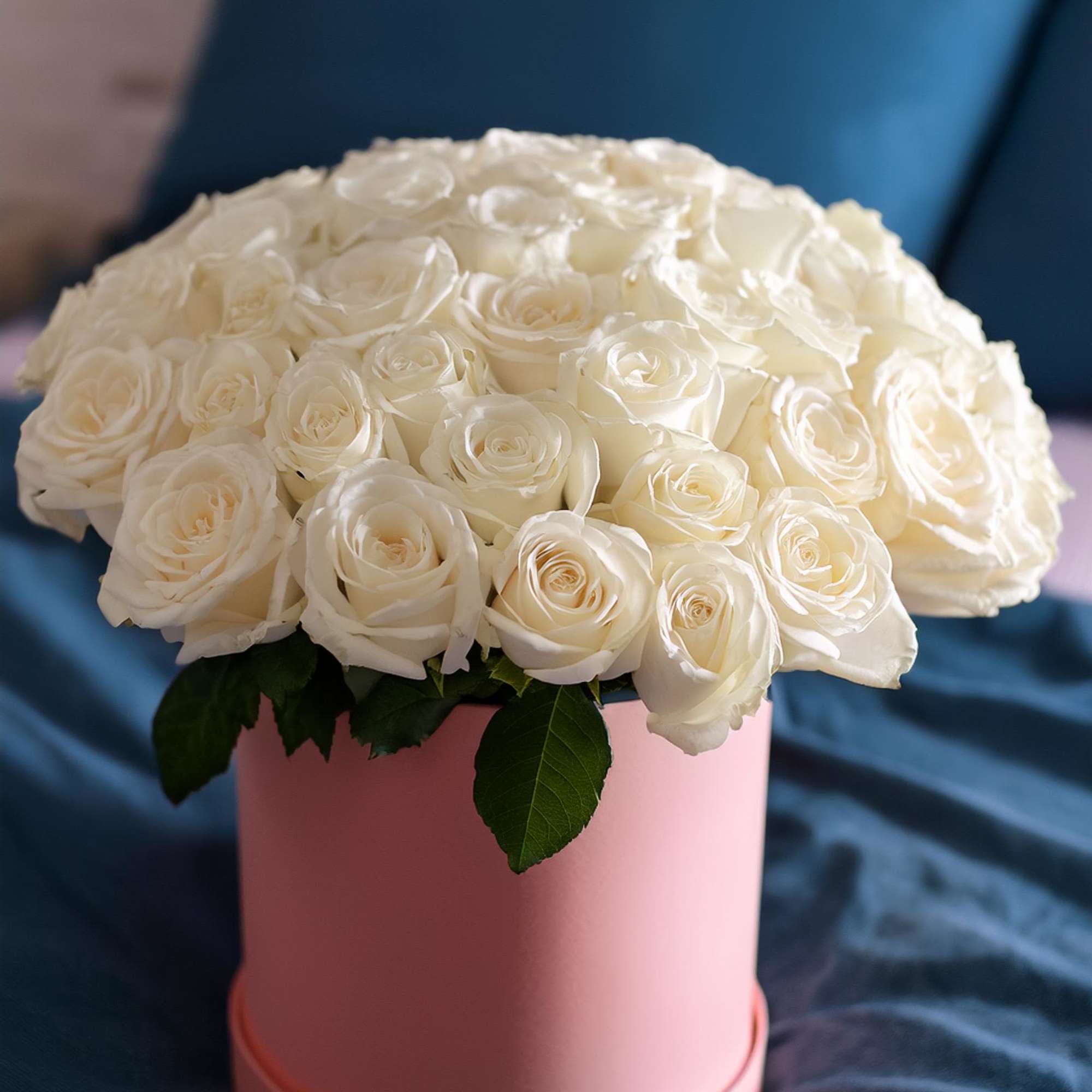 Experience luxury with our stunning white roses, beautifully arranged in a chic
