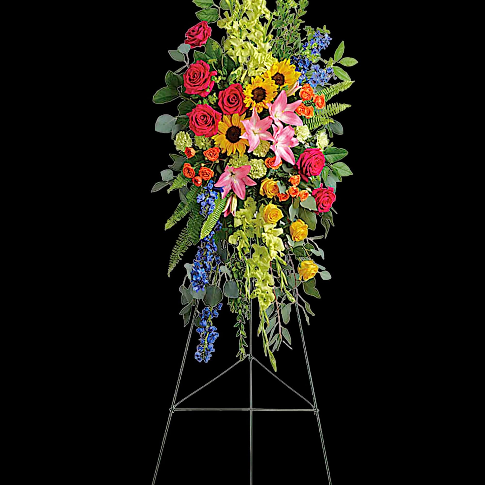 A bold, bright tribute, this rainbow of blooms fills the room with