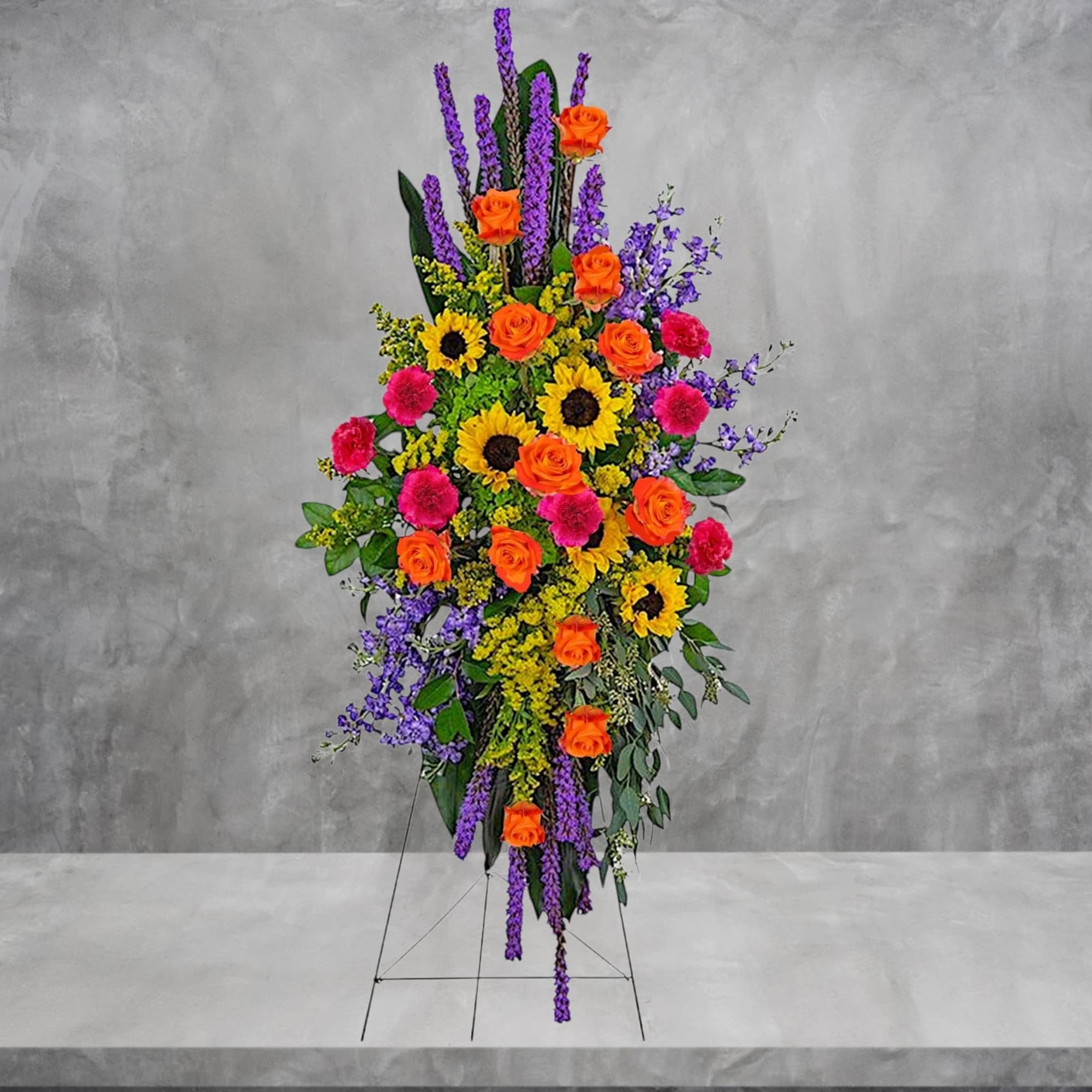 A bold, bright tribute, this rainbow of blooms fills the room with