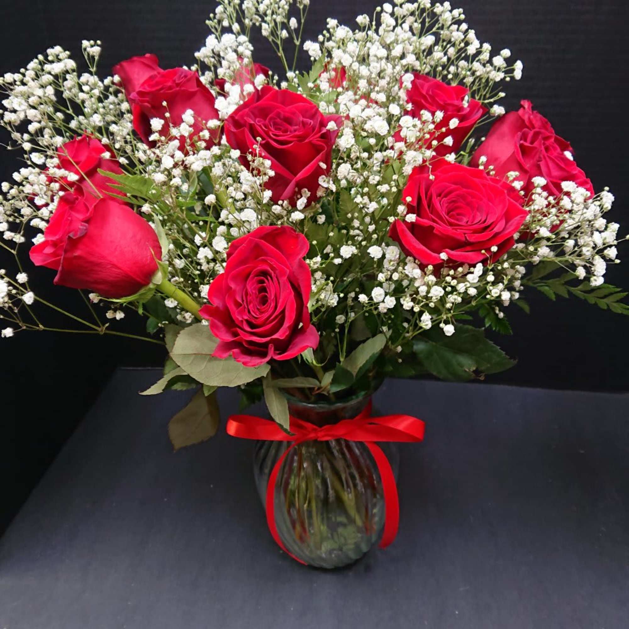 A charming bouquet of a dozen fresh and fragrant red or any