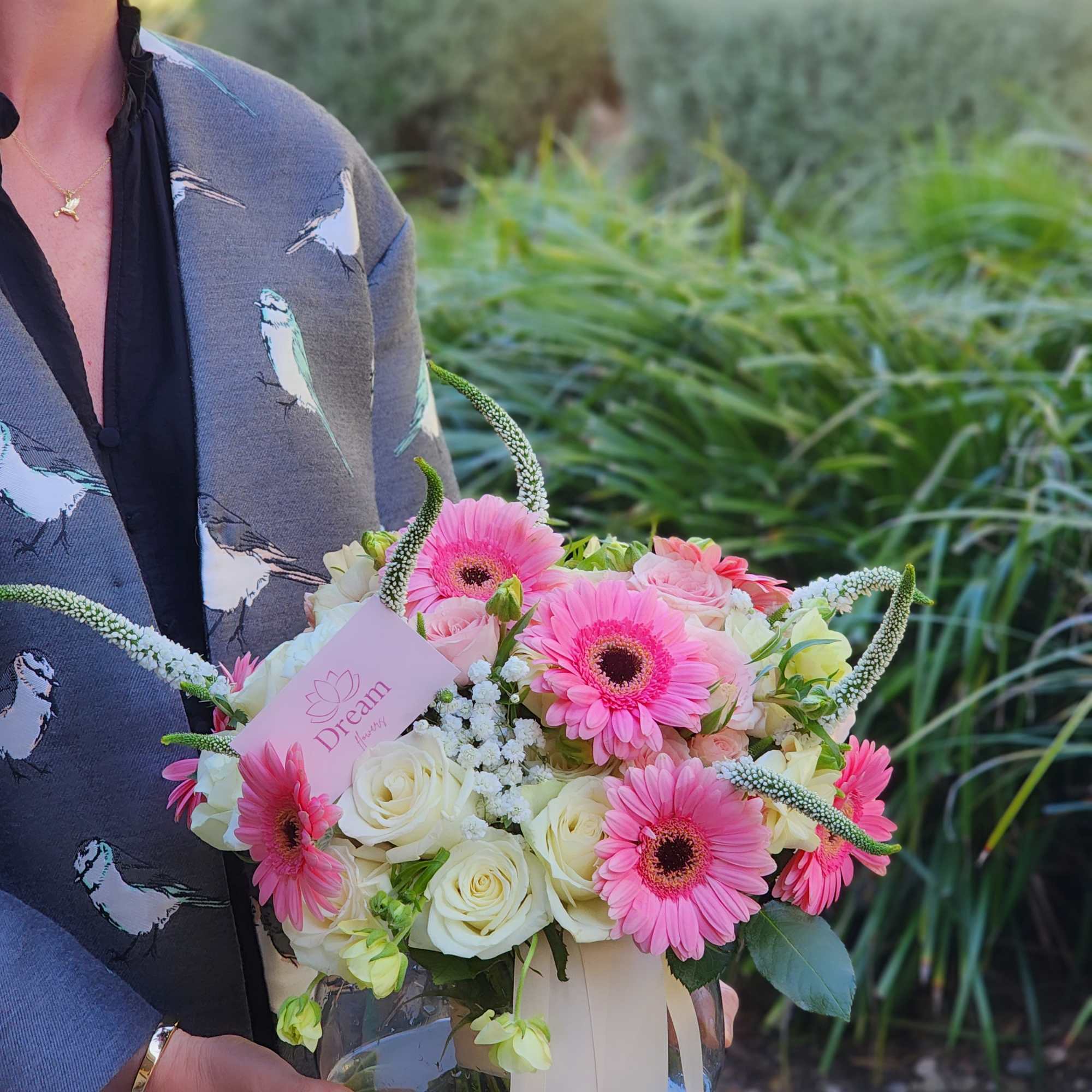 A charming and beautiful bouquet in a clear vase, featuring a delightful
