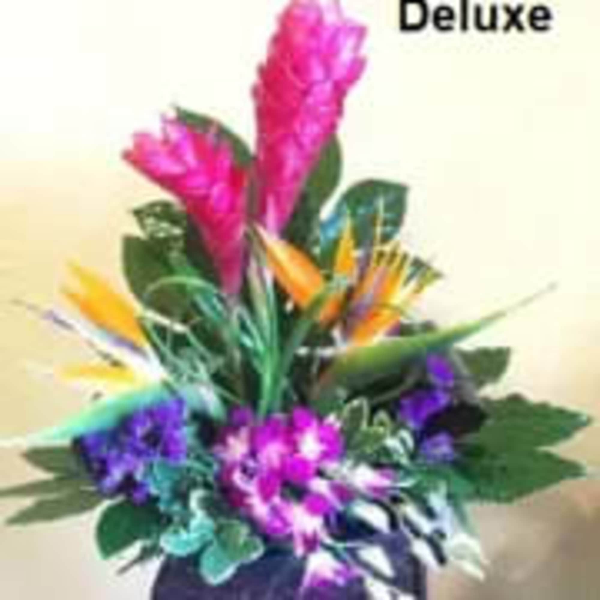 Tropical Flowers as shown arranged in a vase. Deluxe version shows more