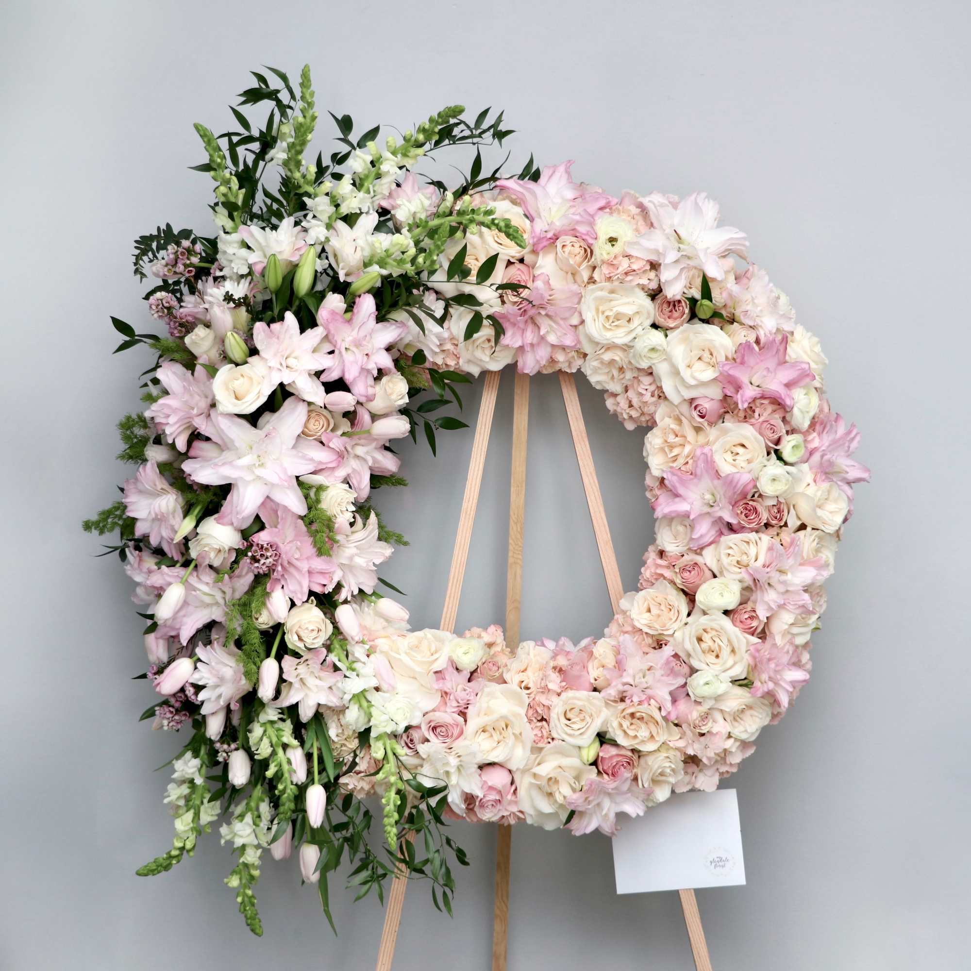Blush colored florals to fill this wreath.

We include easel, printed banner and