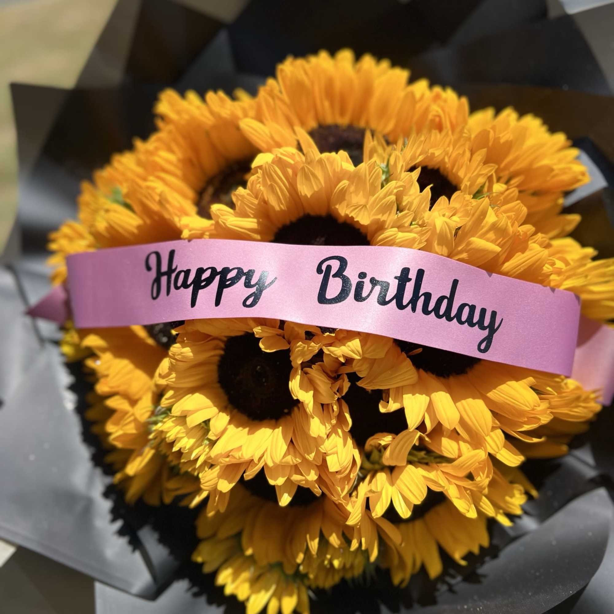 Bouquet of 25 sunflowers with a custome message on the ribbon.