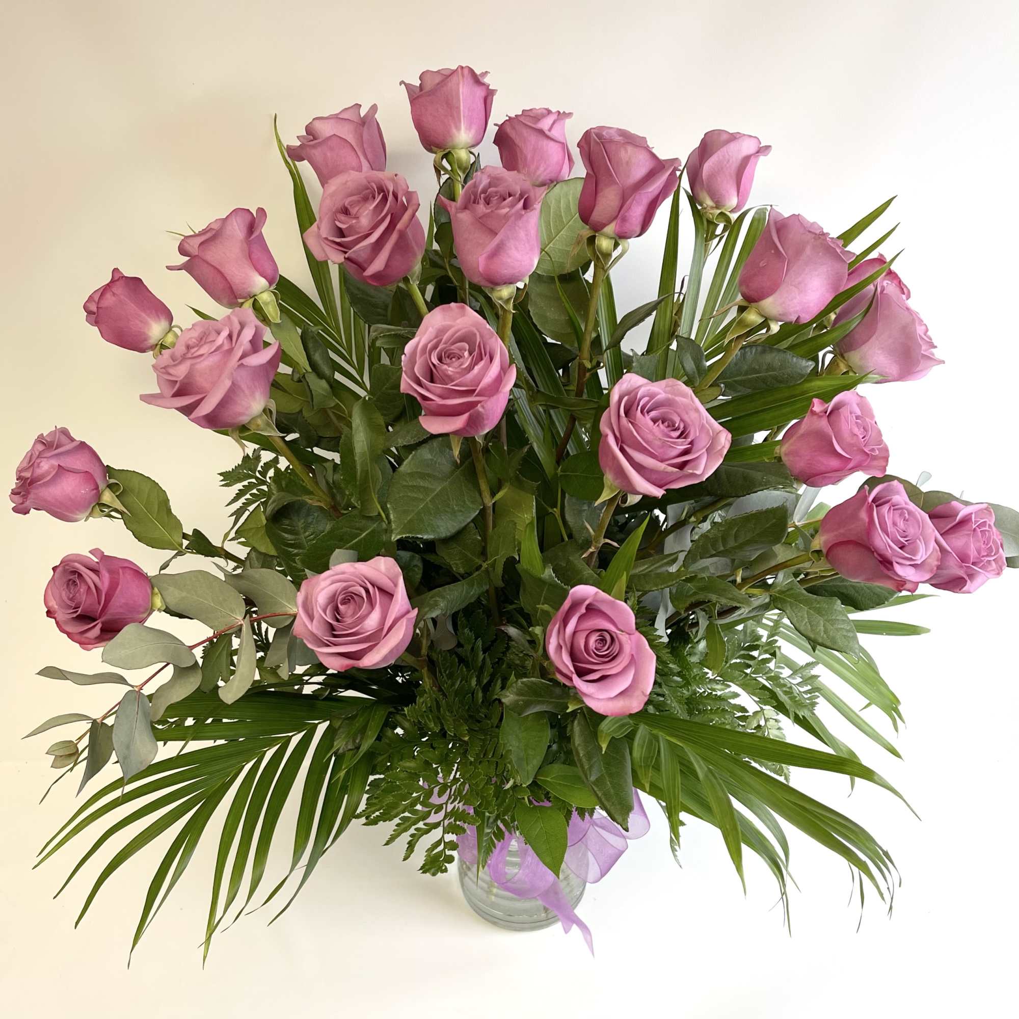 24 Lavender Roses beautifully arranged in a vase. PREMIUM includes higher end 24 Lavender Roses beautifully arranged in a vase. PREMIUM includes higher end