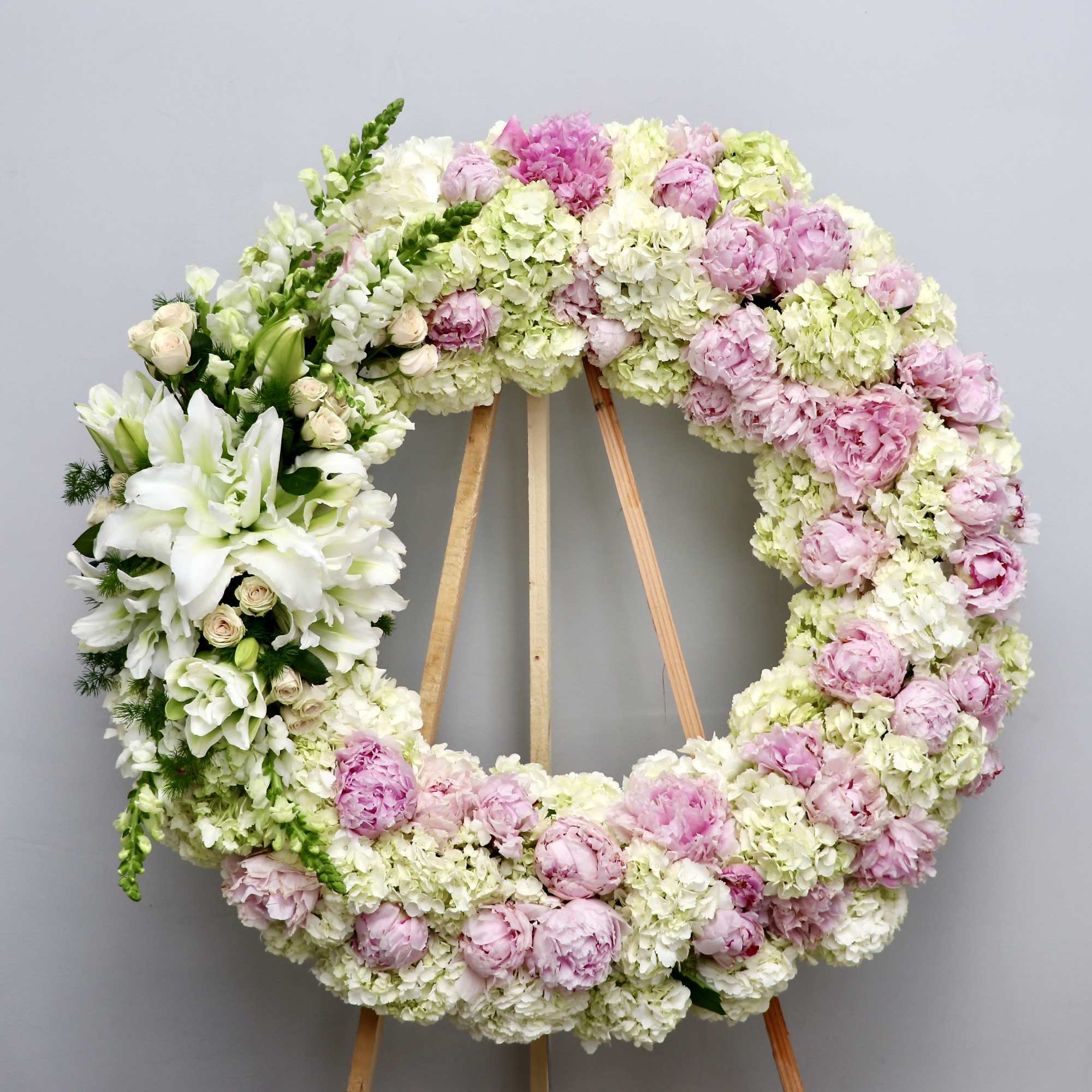 With a mix of blush peony (garden roses when not in season)