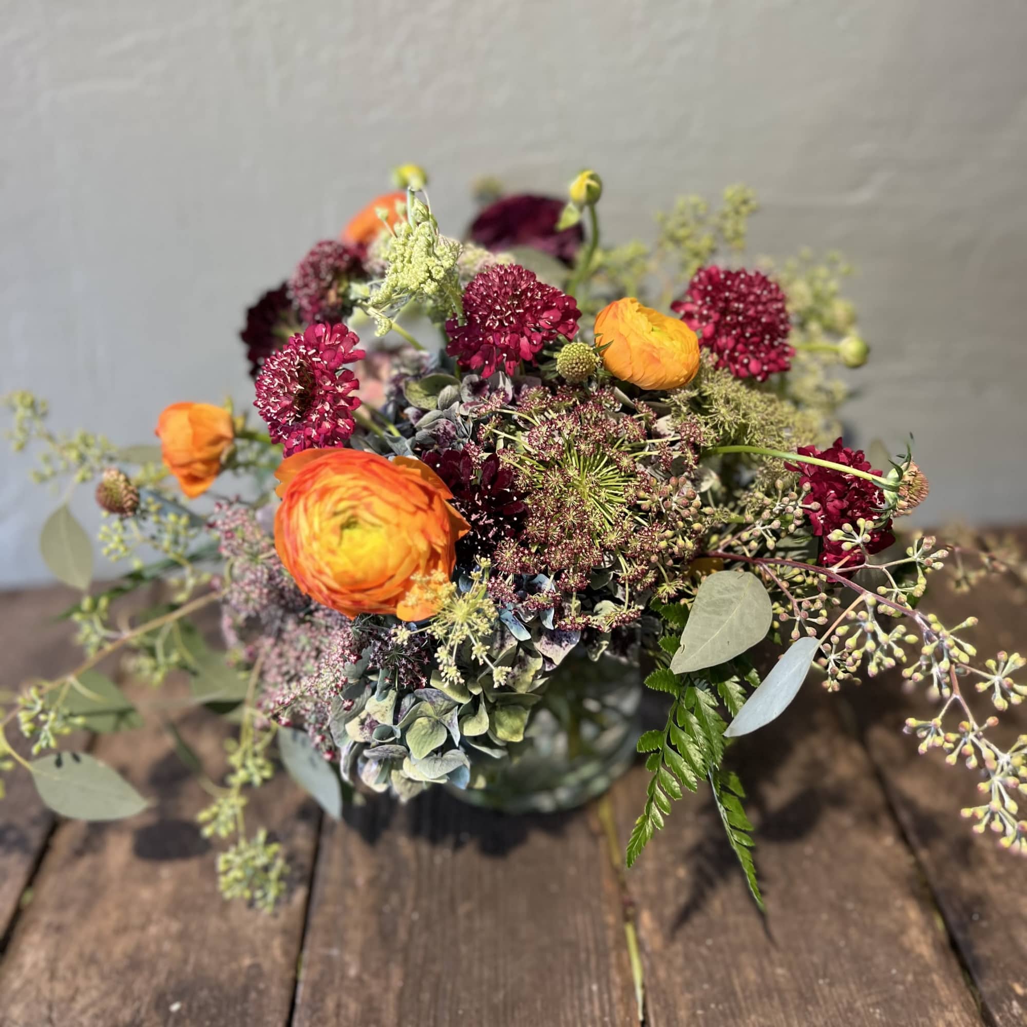 The sweetest table top arrangement with tulips, ranunculus, scabiosa, and filler. 