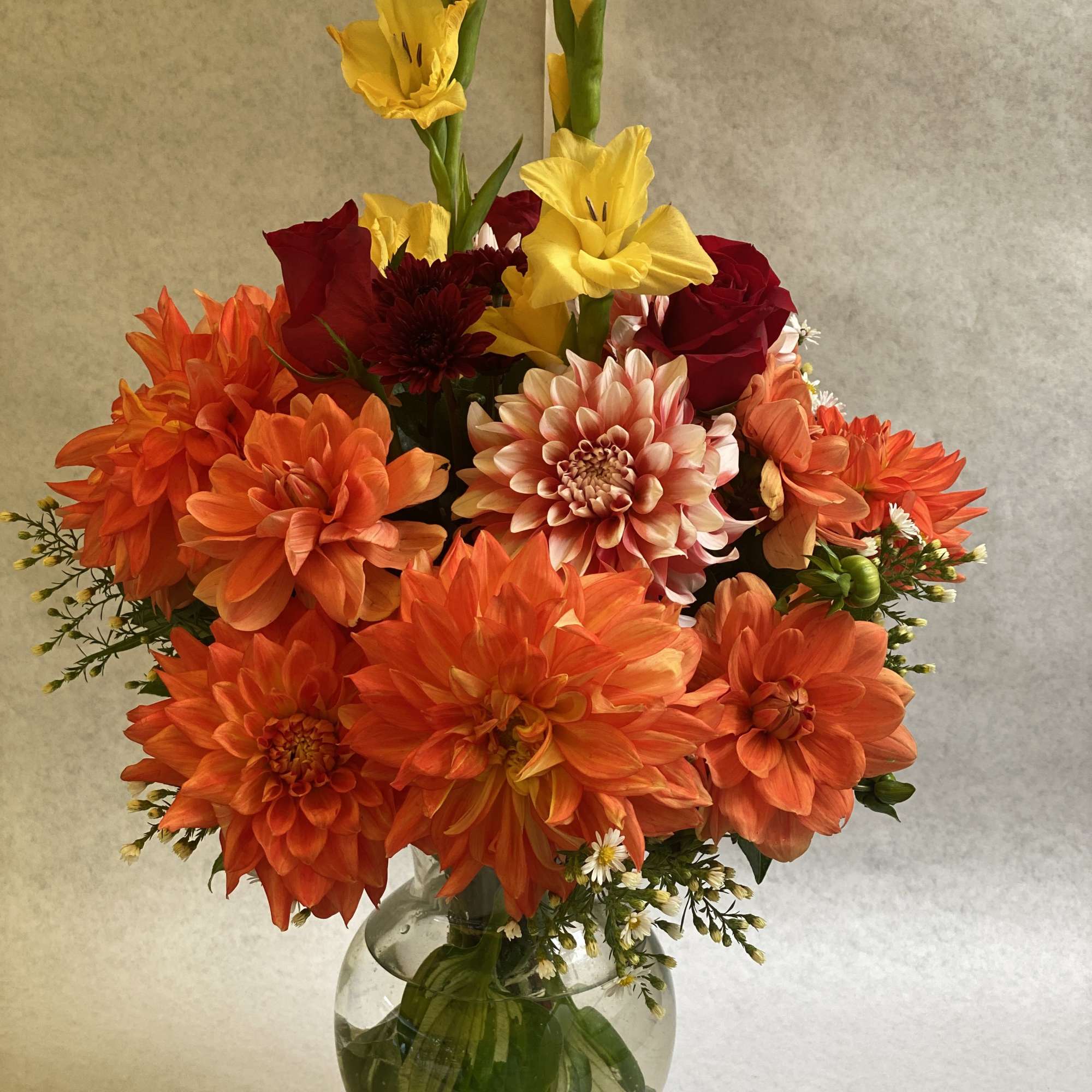 An artistic and bright fall color arrangement is a pleaser and interesting