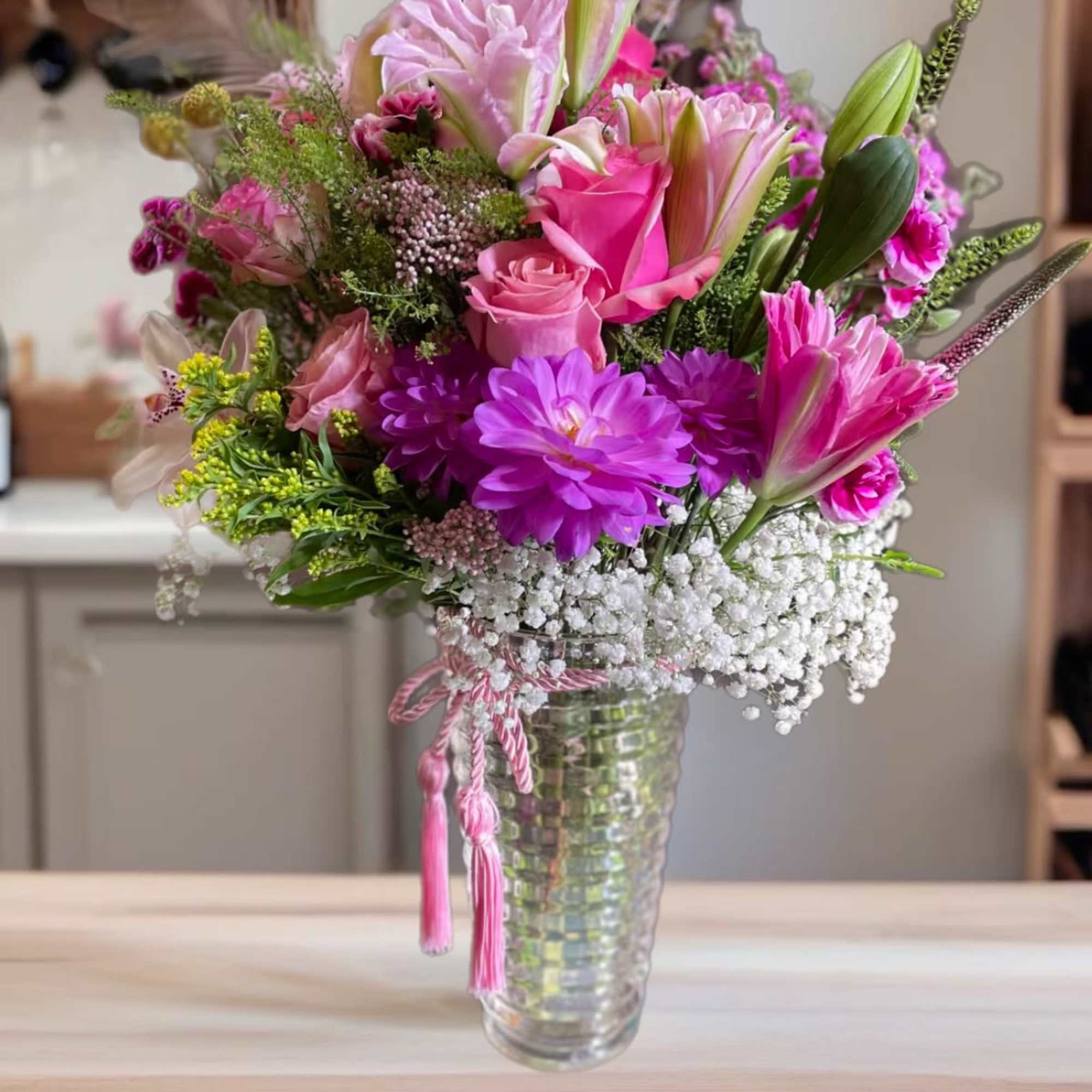 &quot;Exquisite Elegance&quot; is a stunning flower arrangement that combines the timeless beauty